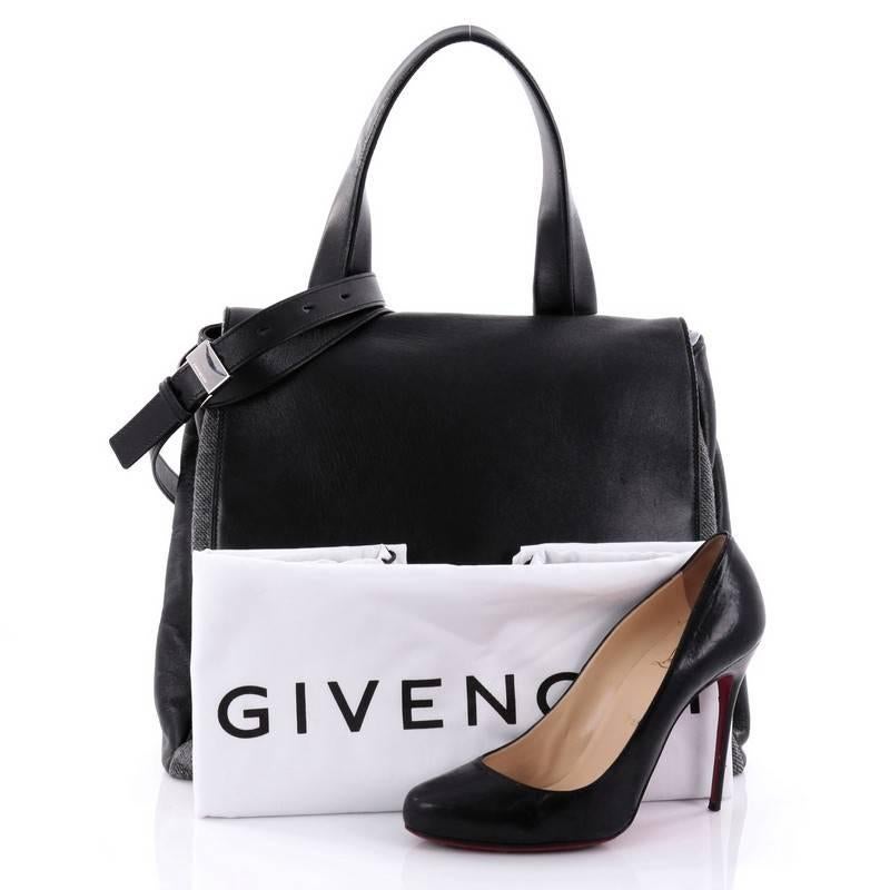 This authentic Givenchy Pandora Pure Satchel Wool with Leather Medium is an updated version of the Pandora, adding versatility to the popular bag. Crafted in black leather and grey wool, this stylish satchel features a frontal flap, single top