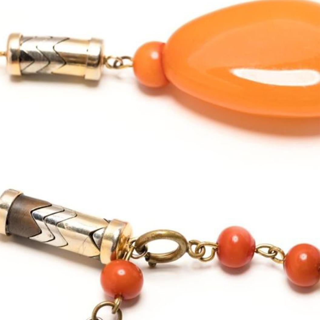 A glorious rare vintage Givenchy necklace with cylindrical motifs, stones in coral, amber, and faux pearl. This pre-owned piece represents the 1970s at its best. Vibrant and fun this standout necklace will add flare to your look.

Colour: