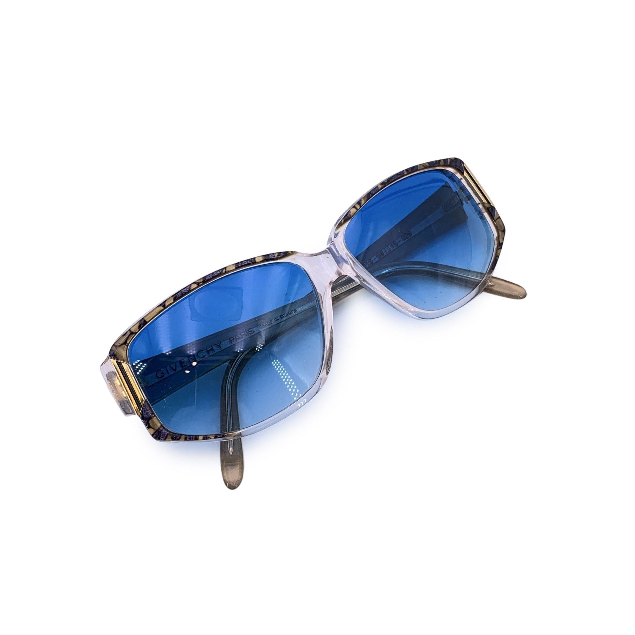 A true gem from the golden age of glamour, these original 1980s Givenchy sunglasses - Model G018 - are the embodiment of vintage elegance with a bold Parisian twist. Featuring a chic rectangle silhouette, the frame is crafted from clear acetate with
