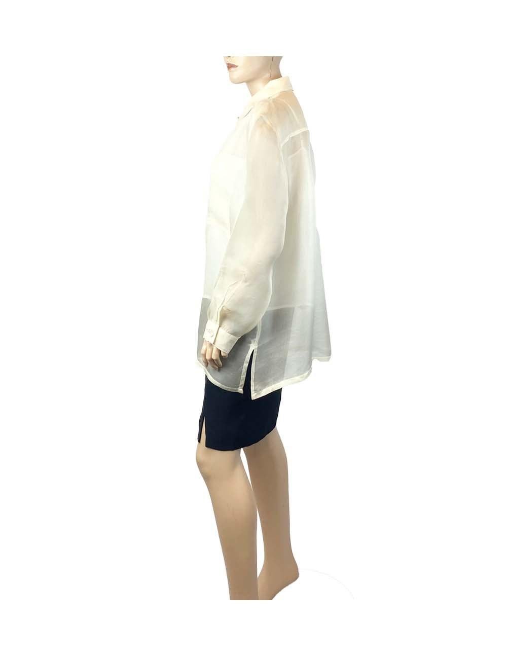 Pearl off-white iridescent sheer lightweight Givenchy collared button-up shirt, with iridescent white buttons and two pockets on the front.

Additional information:
Material: Silk
Size: FR 46
Overall condition: Excellent