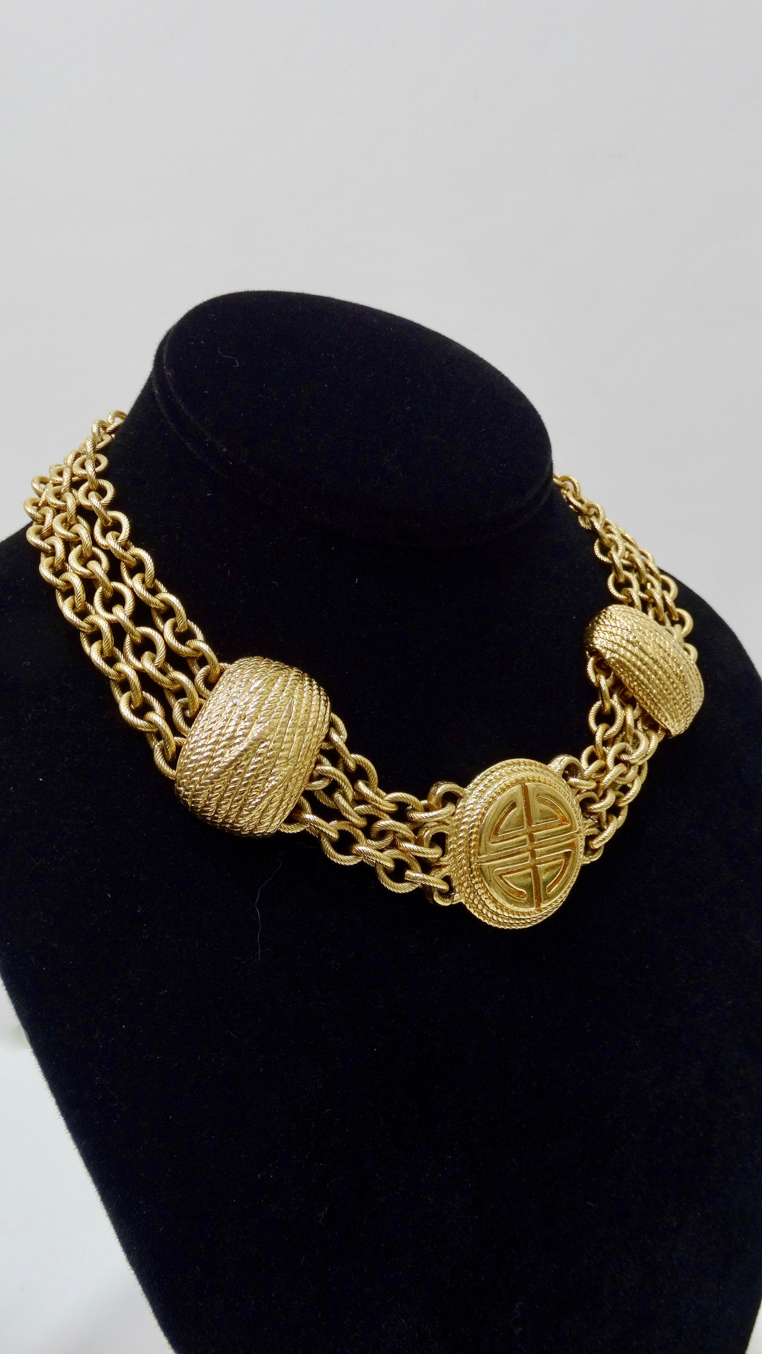 Get your Givenchy fix with this amazing choker! Circa 1980s, this multi-strand chain-link choker is gold toned and features a pendant embossed with the Givenchy logo. Includes an S-hook closure with adjustable length. A timeless piece, this necklace