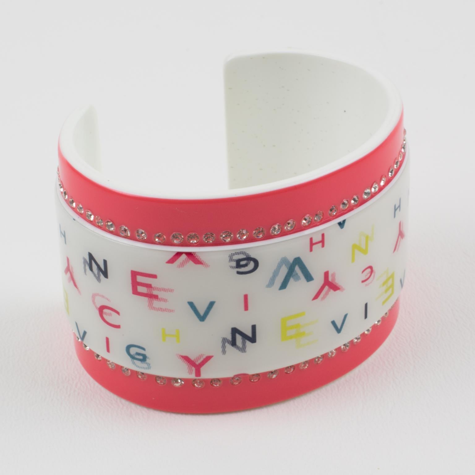 This stylish Givenchy Paris signed cuff bracelet features a massive cuff shape in white and pink salmon resin ornate with multicolor 