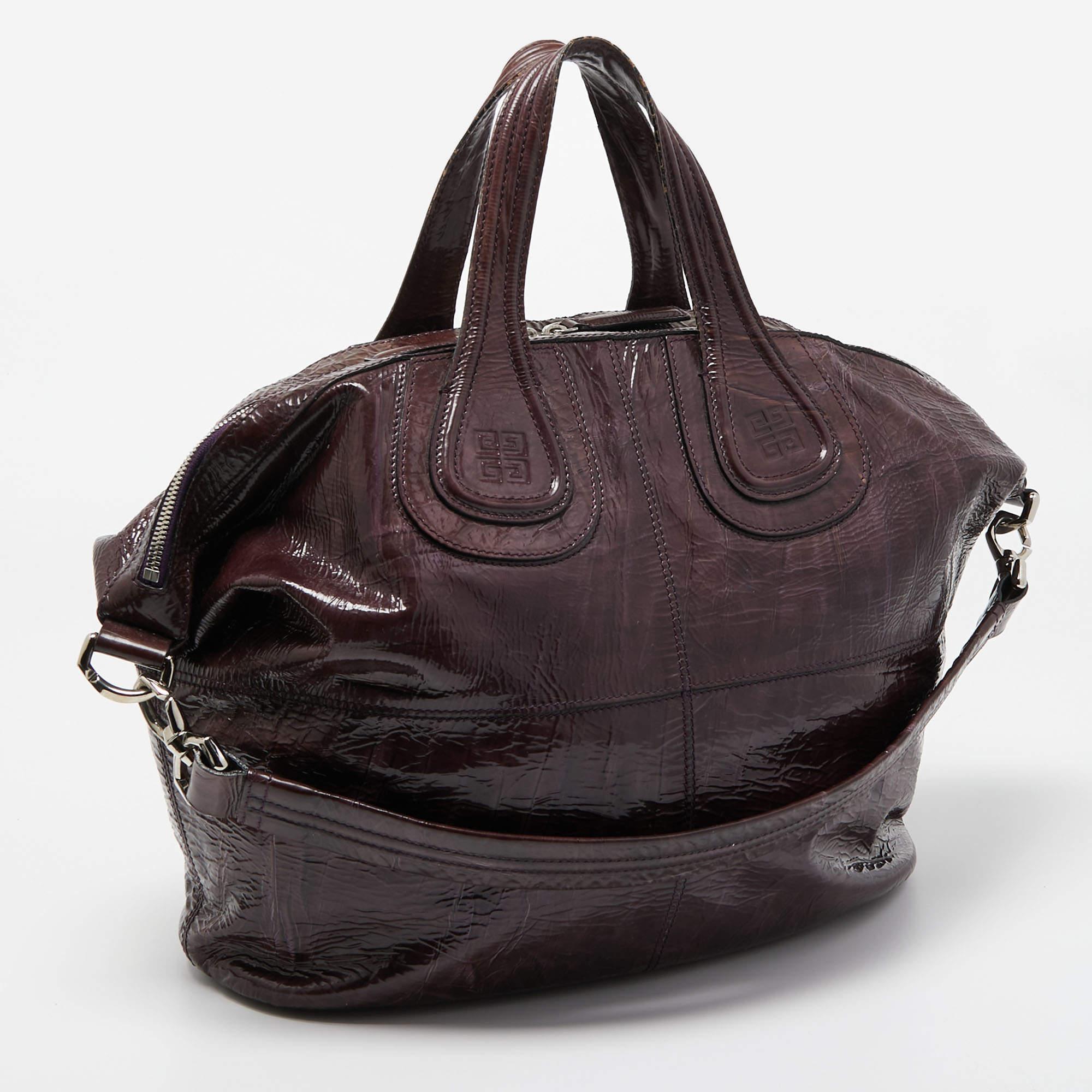Excellently crafted from aged patent leather for a classy touch, this Nightingale bag from Givenchy is a creation that is ideal for daily use and on your travels. It features two top handles, a shoulder strap, and a spacious interior to dutifully
