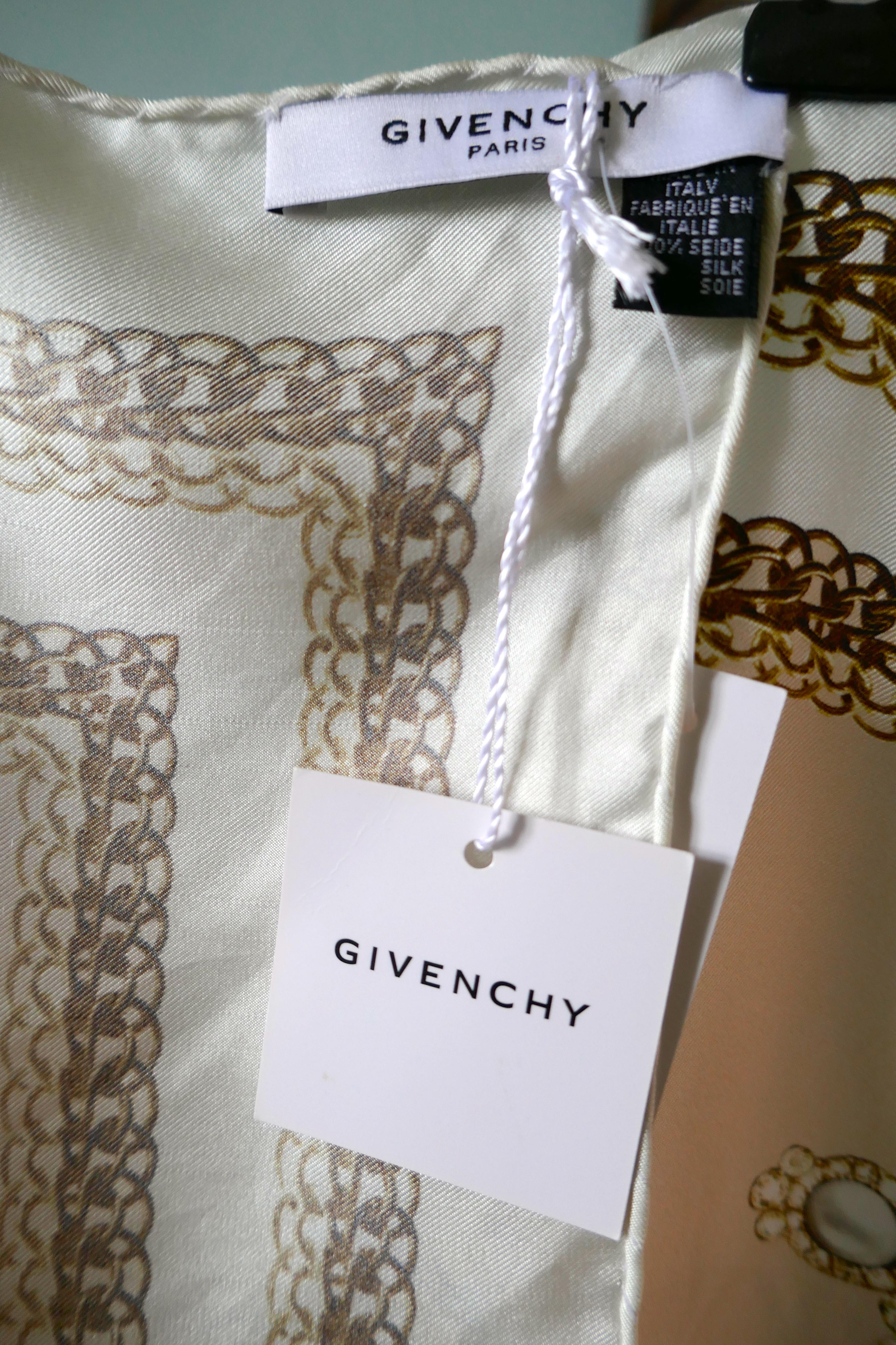 Givenchy Pure Silk Scarf Shawl New With Tags 


In unworn good condition,  creasing due to storage
Logo and GG on many of the items of Jewellery 
Peach background, white border and gold and pearls everywhere 
The Scarf is 35” x 35” 
100% Silk with