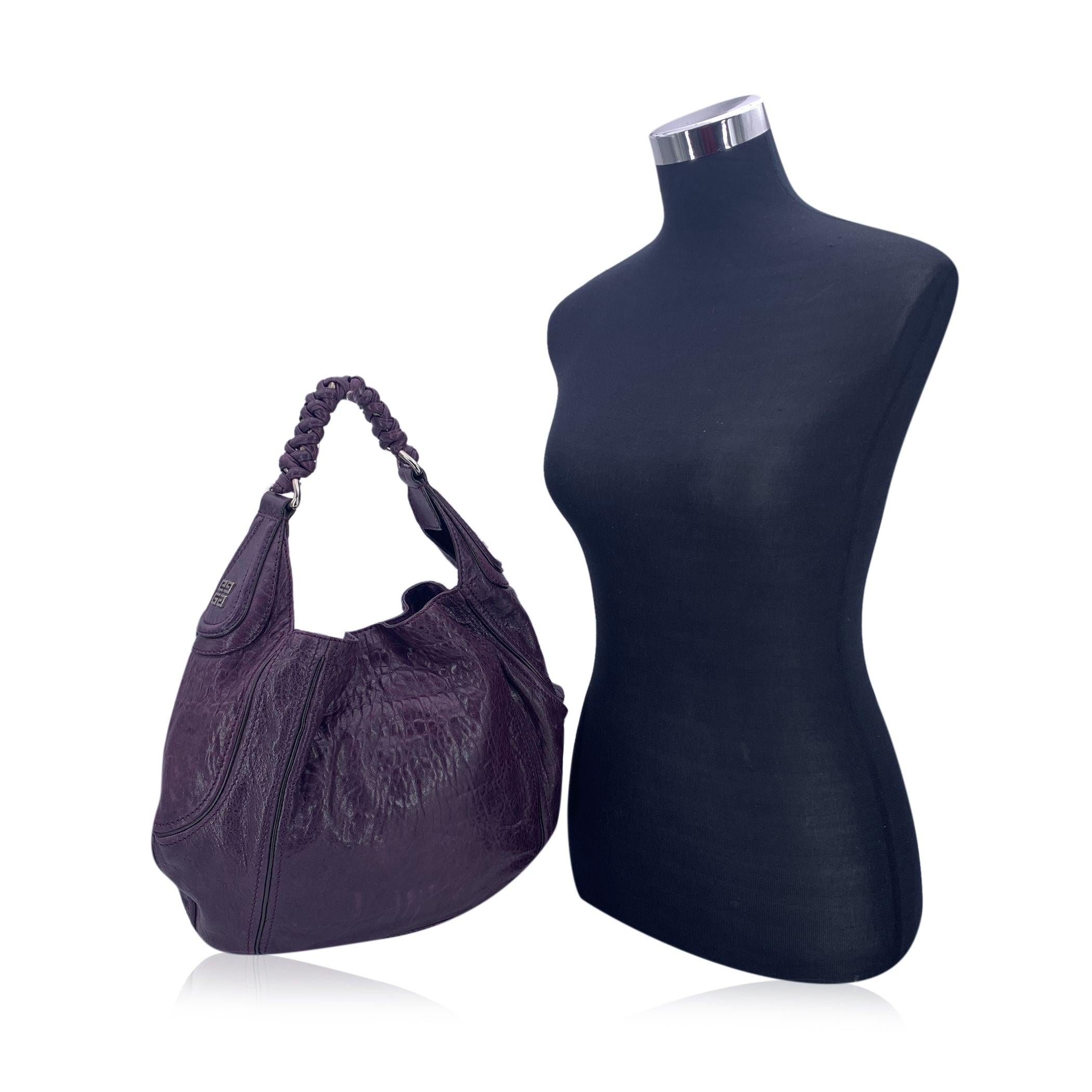 This beautiful Bag will come with a certificate of authenticity provided by third party authenticators. The certificate will be provided at no further cost. Givenchy 'Eclipse' bag in purple distressed leather. Magnetic button closure. Black fabric