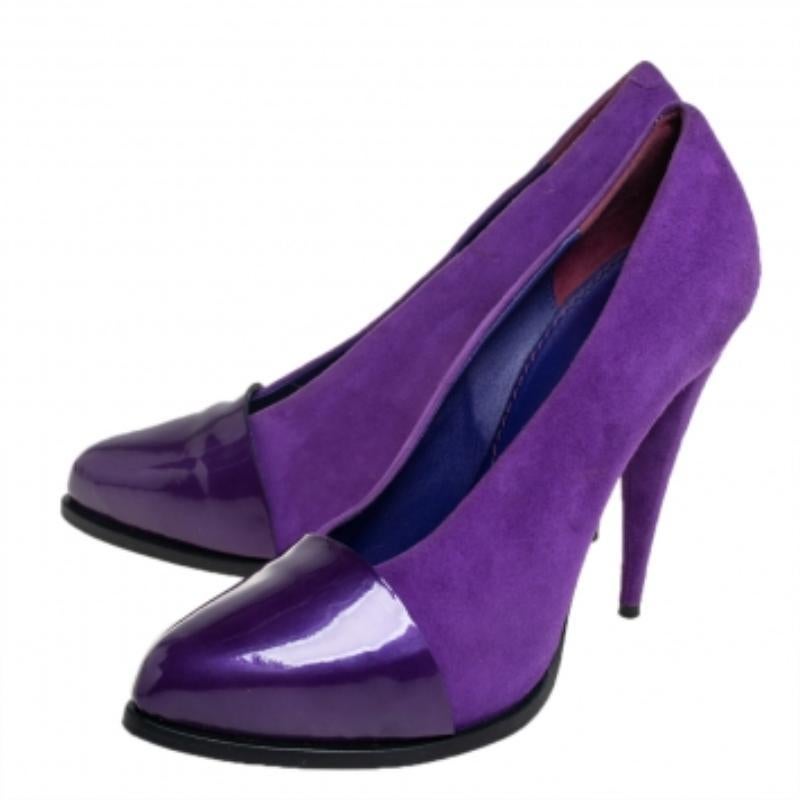A fine reflection of contemporary style, these pumps from Givenchy are made of suede and patent leather, The pair is defined by a purple hue. Elevated by 12 cm stiletto heels, these pumps can be styled with varied shades of formal as well as casual