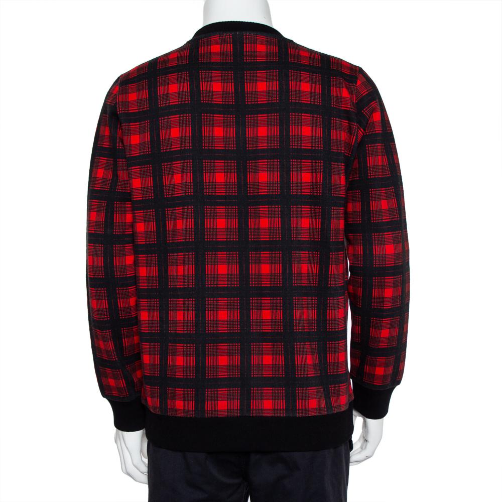 A tartan crewneck sweatshirt by Givenchy featuring Doberman graphic print on the front. Made from cotton, it features long sleeves, black ribbed panels, and a comfortable fit.


