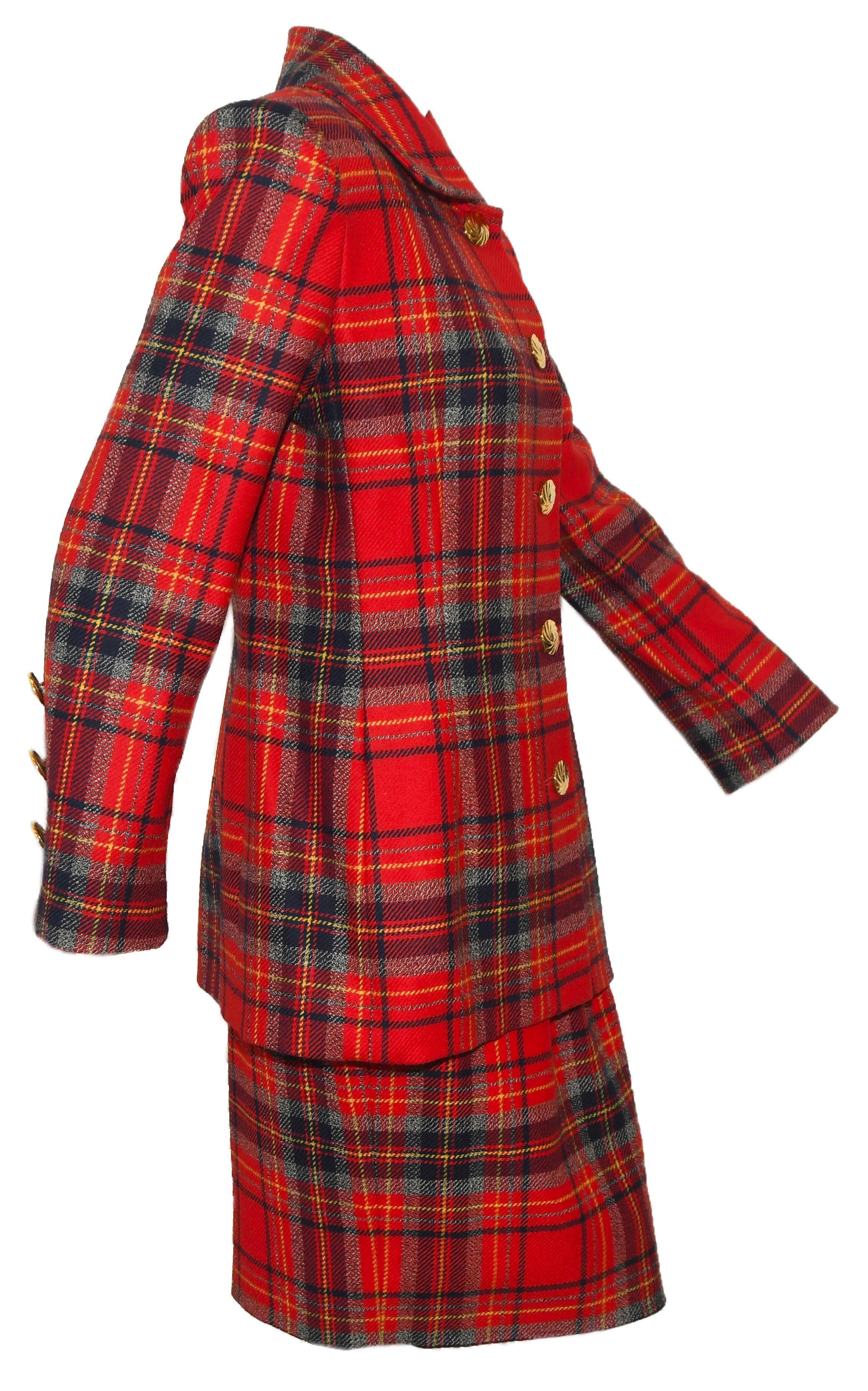 Givenchy red tartan skirt suit includes a shirt collar and, also gold tone buttons at front closure.  The  cuffs are decorated with 3 gold tone buttons.  This suit is lined in red acetate.   This ensemble is in excellent condition.   Made in France  