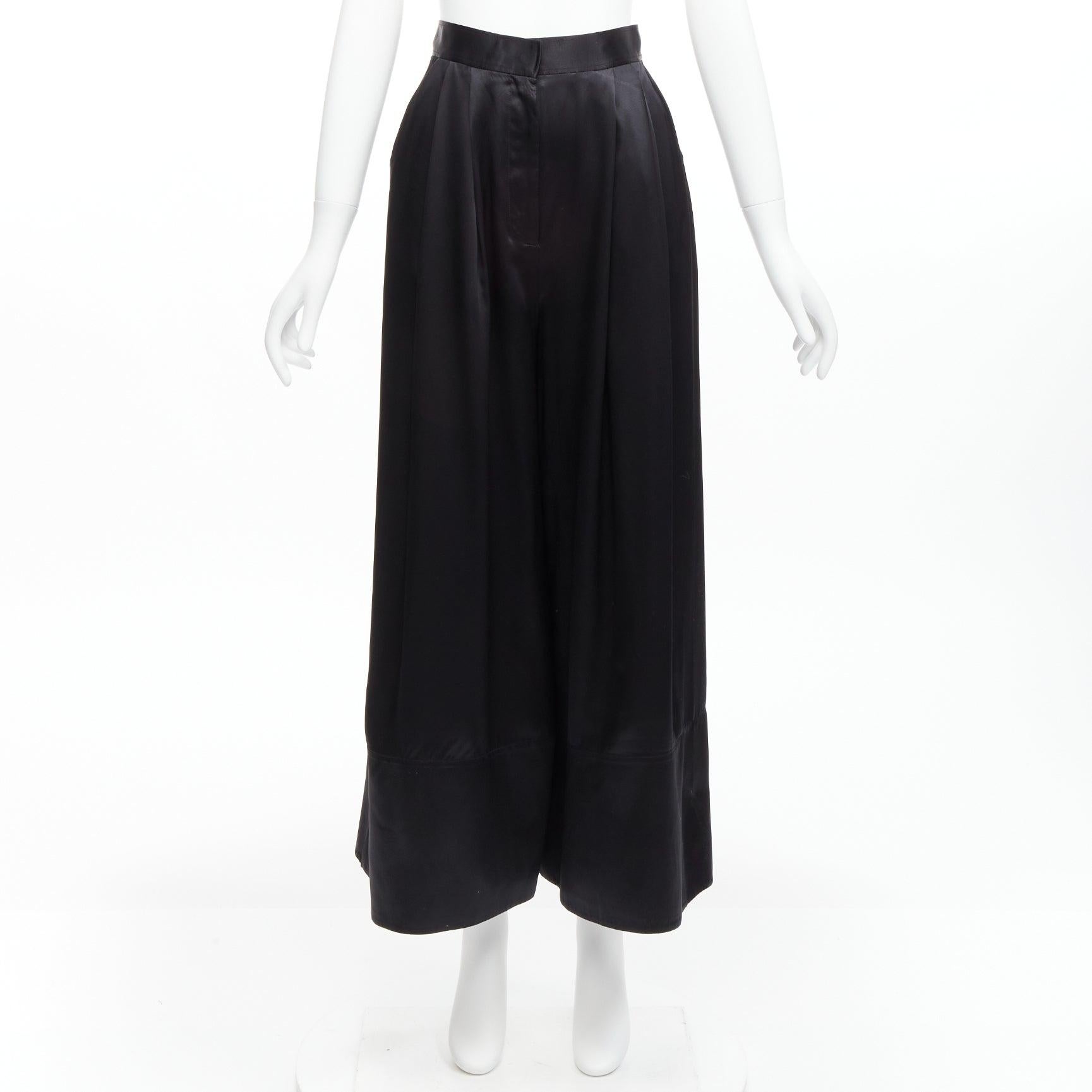 GIVENCHY RICCARDO TISCI black 100% silk satin high waisted wide leg pants
Reference: VACN/A00047
Brand: Givenchy
Designer: Riccardo Tisci
Material: Silk
Color: Black
Pattern: Solid
Closure: Zip Fly
Made in: Italy

CONDITION:
Condition: Excellent,