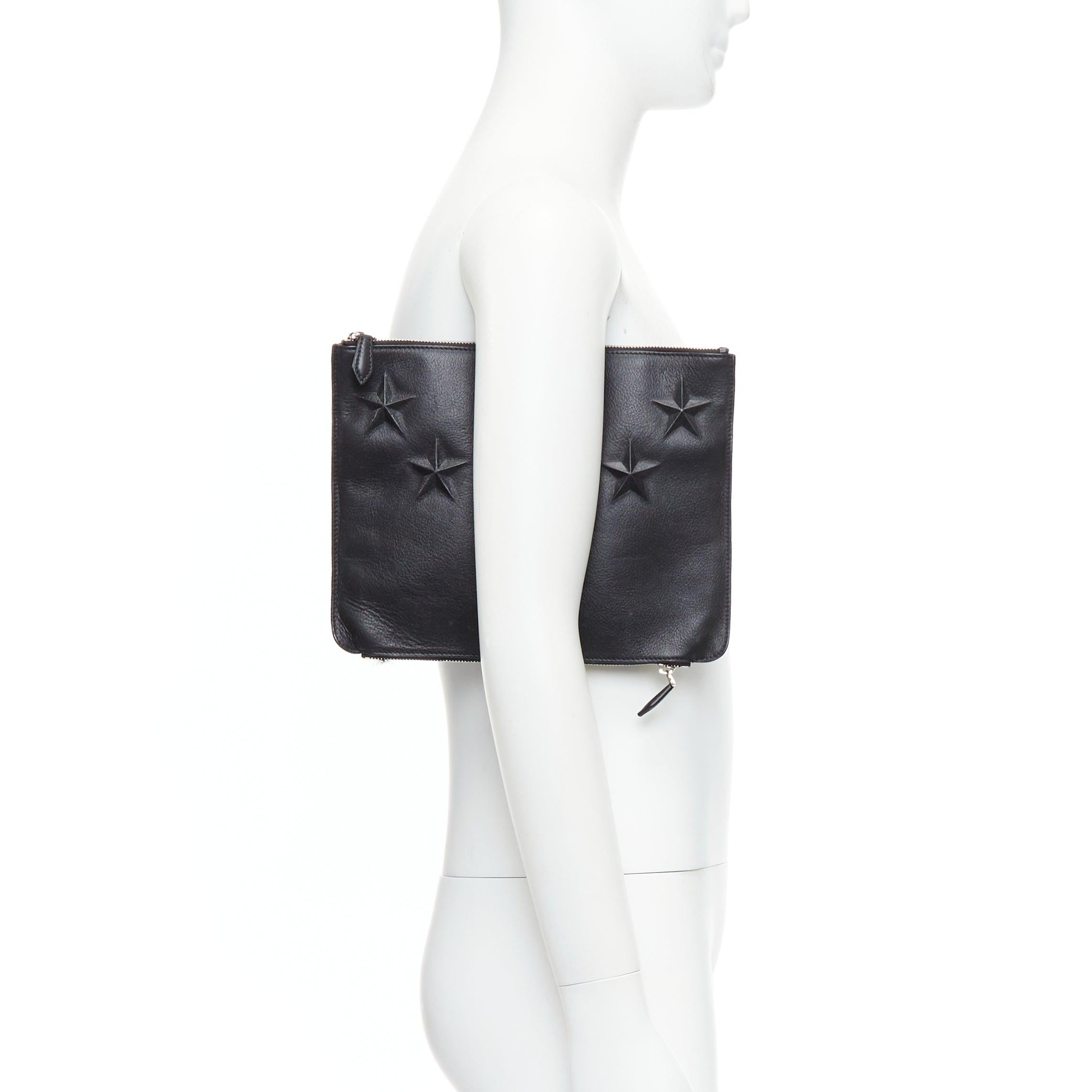 GIVENCHY Riccardo Tisci black leather star debossed double zip clutch bag
Reference: VACN/A00052
Brand: Givenchy
Designer: Riccardo Tisci
Material: Leather
Color: Black, Silver
Pattern: Star
Closure: Zip
Lining: Black Leather
Made in:
