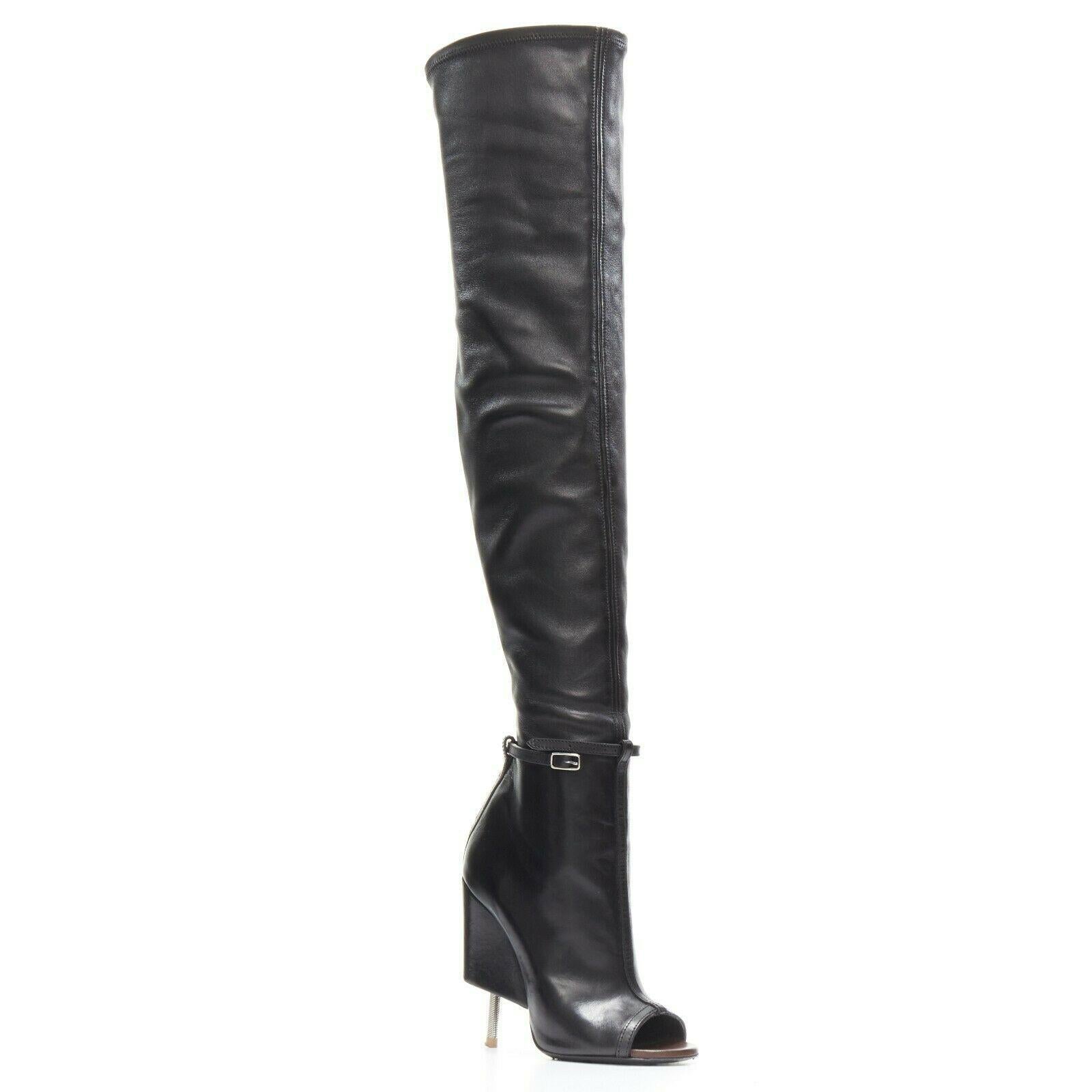 GIVENCHY RICCARDO TISCI Narlia black leather thigh high boots wedge heel FR37
Designer: GIVENCHY BY RICCARDO TISCI
Model / Season: Spring / Summer 2015, Narlia
Material: Lambskin leather
Color: black
Pattern: plain
Description: Thigh high boots. 3/4