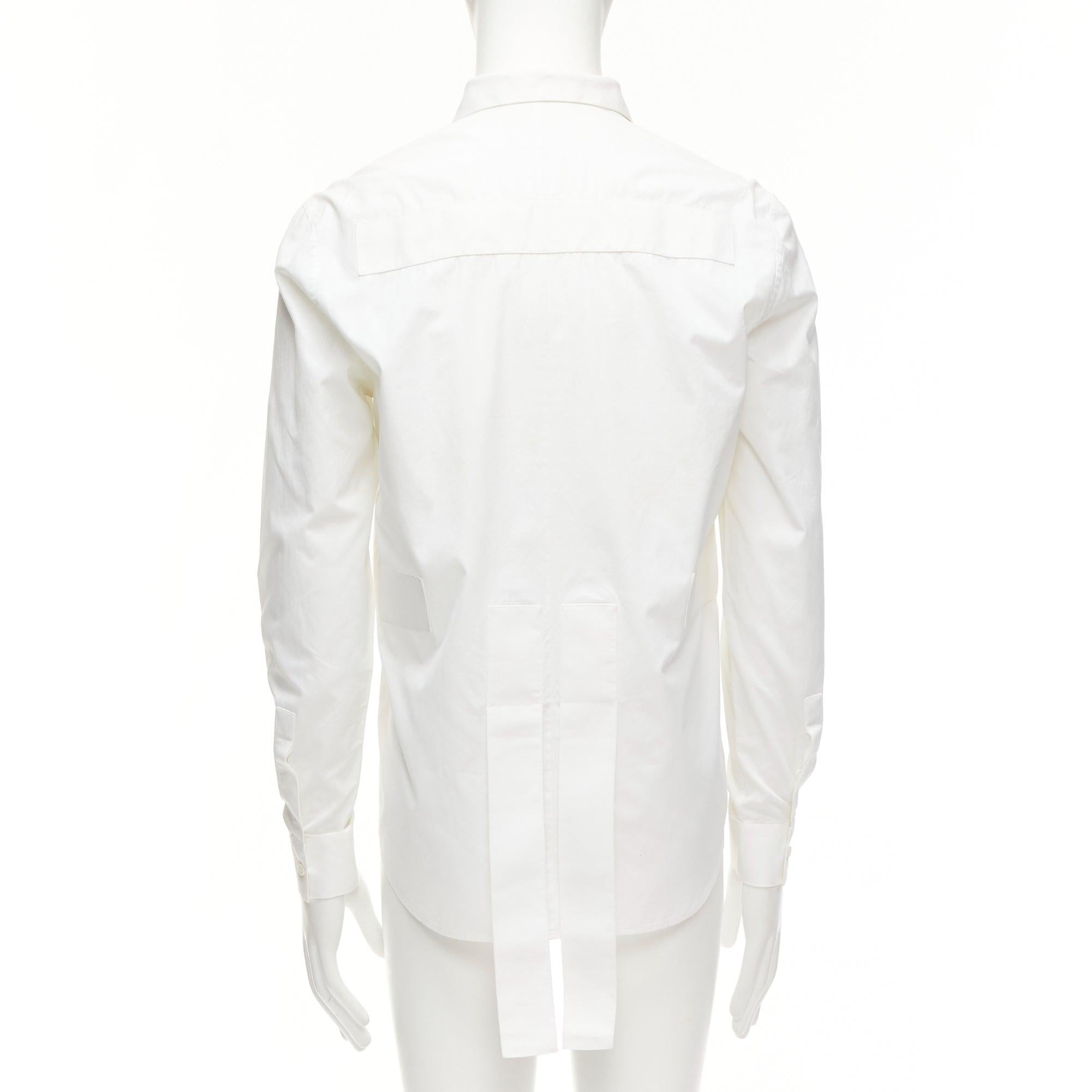 GIVENCHY Riccardo Tisci white cotton band applique shirt EU39 M
Reference: MLCO/A00013
Brand: Givenchy
Designer: Riccardo Tisci
Material: Cotton
Color: White
Pattern: Solid
Closure: Button
Lining: White Fabric
Extra Details: White lined applique at