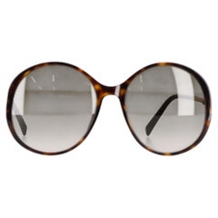 Gafas de sol redondas y oversize de Givenchy en acetato marrón