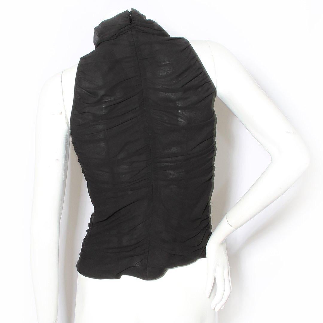 Ruched blouse by McQueen for Givenchy
Mid 90s- early 2000s 
Black
Silk
Ruched design
Turtleneck
Sleeveless
Zip back closure
Made in Italy
Condition: Good. Slight discoloration under the arm.

Size/Measurements: (approximate, taken flat) 
Size 36
31