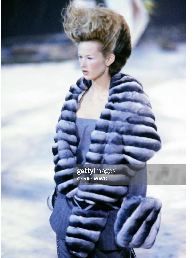 GIVENCHY - Grey flecked woolen set with tennis stripes and a chinchilla impressive collar on the wide jacket. Givenchy Haute Couture - Collection Autumn-Winter 1998 by Alexander McQueen. No size nor composition label, it fits a