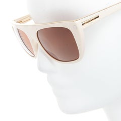Lunettes de soleil GIVENCHY SGV883 en acétate crème avec logo en haut et en or