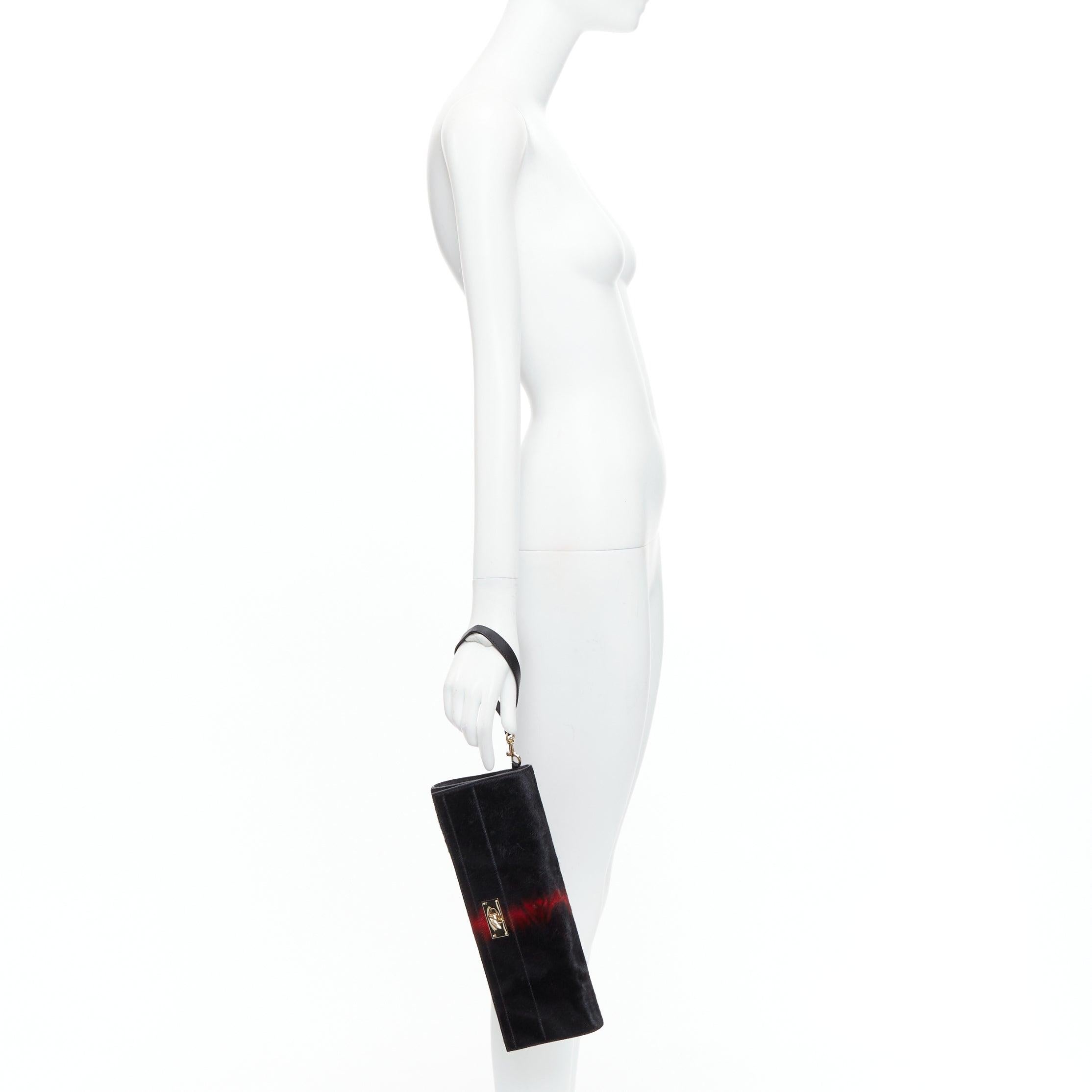 GIVENCHY Shark black red ponyhair gold turnlock foldover clutch bag
Reference: VACN/A00051
Brand: Givenchy
Designer: Riccardo Tisci
Model: Shark
Material: Pony Hair, Leather
Color: Black, Red
Pattern: Solid
Closure: Turnlock
Lining: Black
