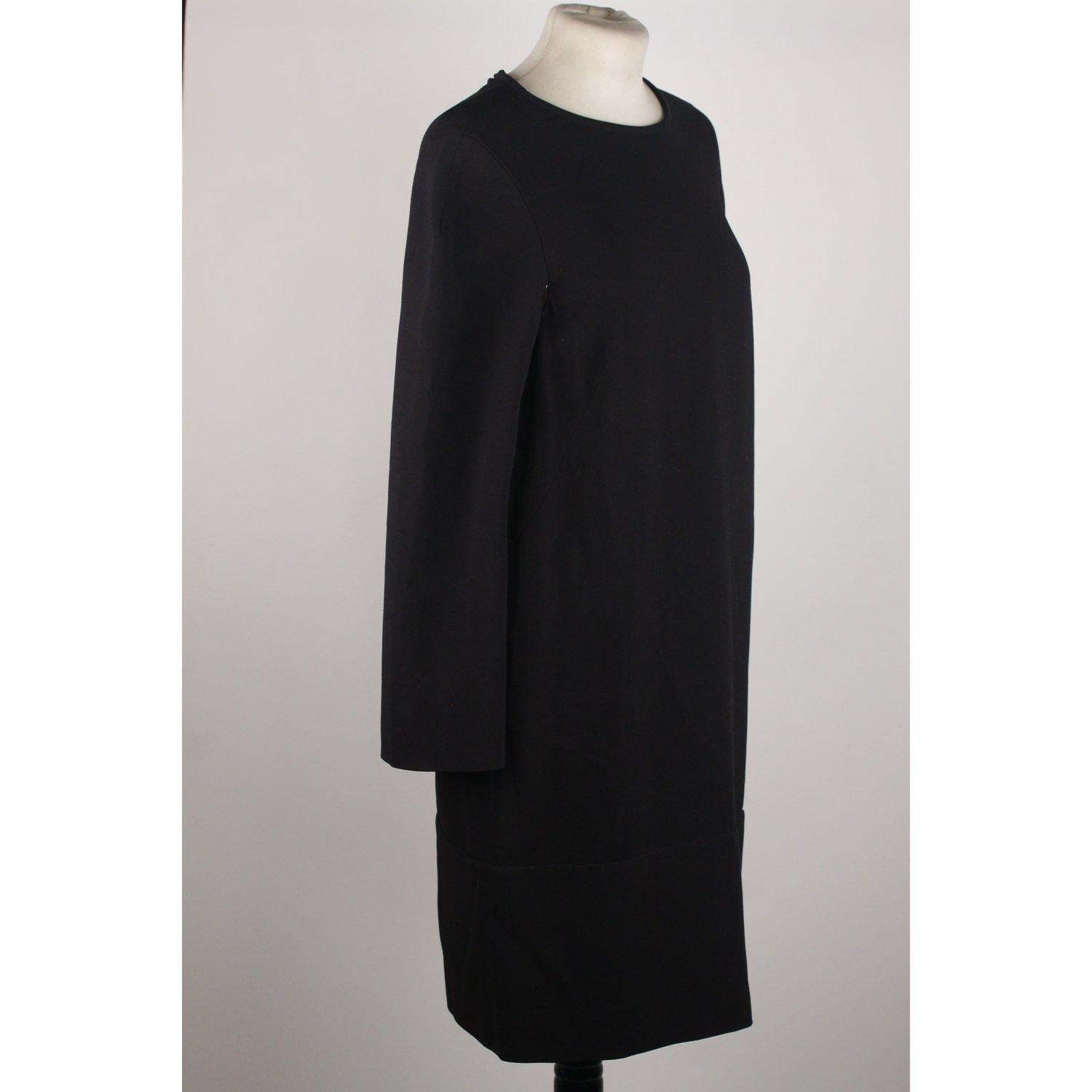 MATERIAL: Viscose COLOR: Black MODEL: Sleeveless Dress GENDER: Women SIZE: Small COUNTRY OF MANUFACTURE: Unknown Condition CONDITION DETAILS: B :GOOD CONDITION - Some light wear of use - Previously worn with moderate wash wear/fade and or minor