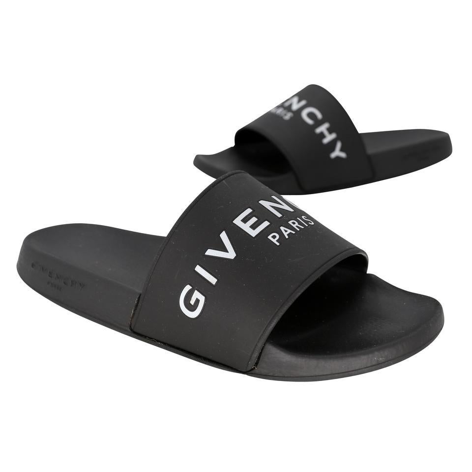 Givenchy limited edition white print CLASSIC pool side sandals women's size 9. These are currently a hot must have item perfect for walking around with style SOLD OUT completely on in back order. Sandals are in pre-loved condition with basic wear