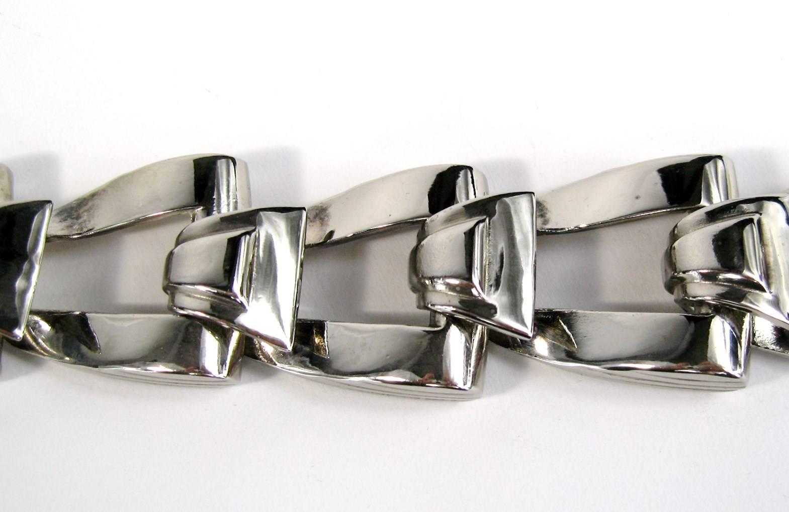 Great large Givenchy link bracelet. Fold over closure. Measuring 1.11 inches wide. 9-1/4 long end to end. Will fit a 7-8 inch wrist nicely. This is out of a massive collection of Hopi, Zuni, Navajo, Southwestern, sterling silver, costume jewelry and