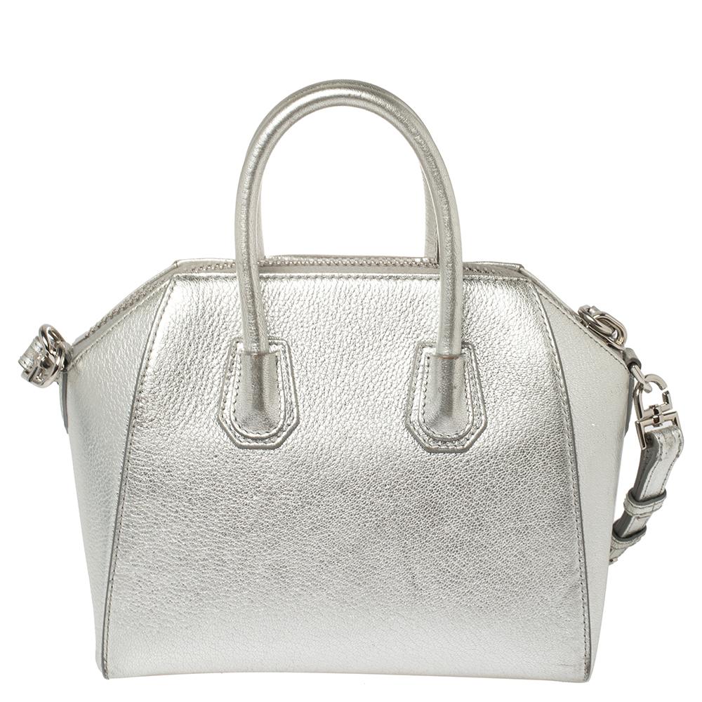 Made in Italy, and loved by women worldwide is this beautiful Antigona satchel by Givenchy. It has been crafted from leather and shaped elegantly. The silver bag has a top zipper that reveals a canvas interior and it is held by two top handles and a