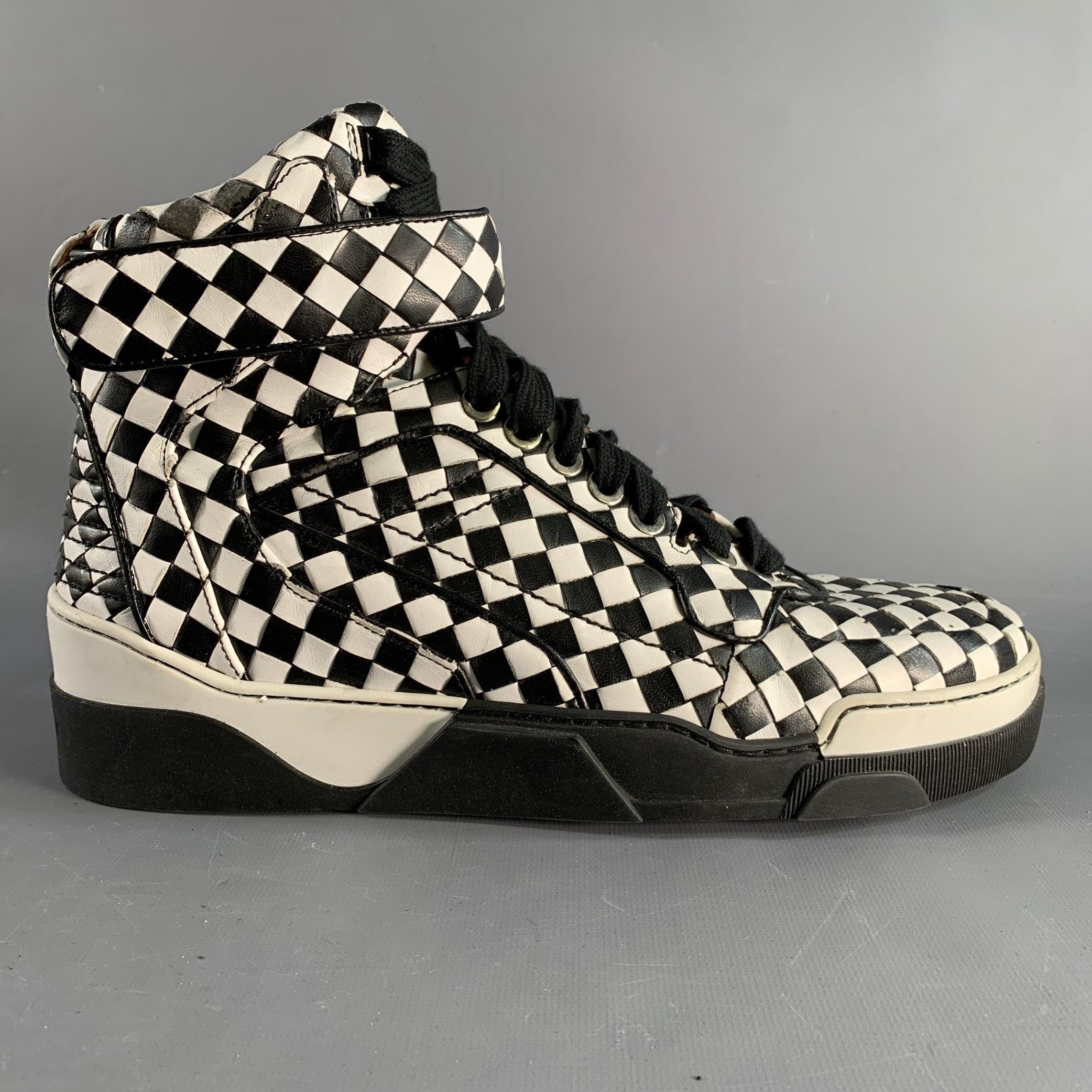 GIVENCHY Riccardo Tisci high top sneakers comes in a black and white leather featuring a
 checkered style, rubber sole, and a lace up style.Very Good Pre-Owned Condition. Light wear. 

Marked:   44 

Measurements: 
  Length: 12 inches Width: 4.25