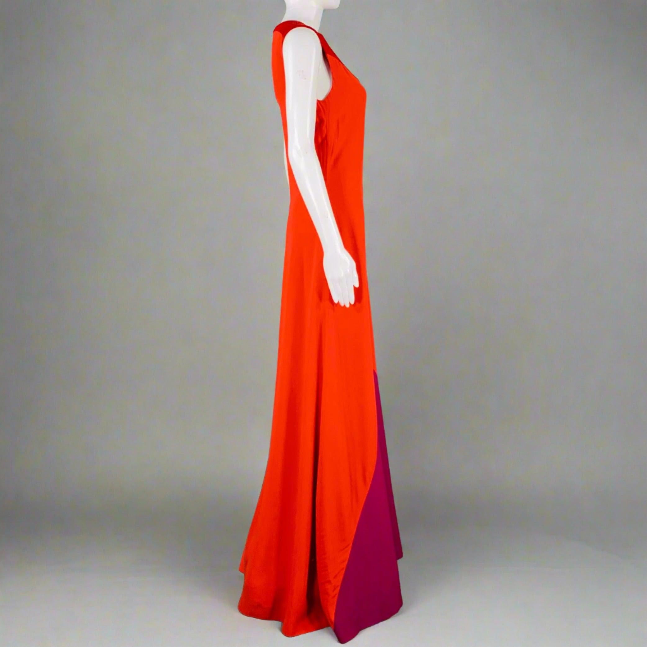 GIVENCHY dress
in a red and purple viscose blend fabric featuring a sleeveless style, color block design, and invisible back zipper closure.Very Good Pre-Owned Condition. Water mark on front, which is only noticeable when looking closely. 

Marked: 