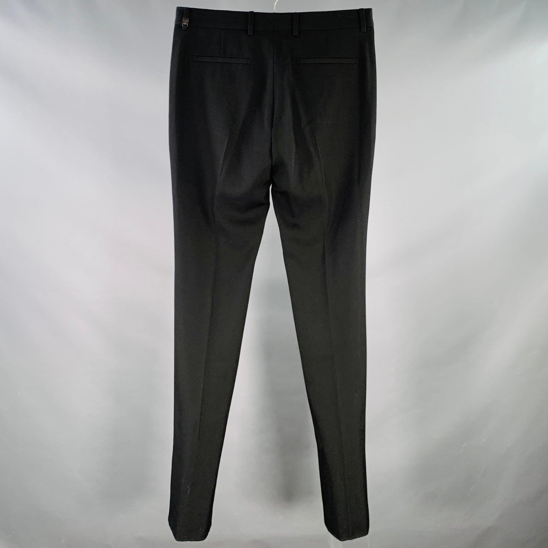 GIVENCHY dress pants
in a black wool featuring a flat front, tapered leg, and zip fly closure. Made in Italy. Hem has been left unfinished to tailor to your perfect fit.New with Tags. 

Marked:   IT 48 

Measurements: 
  Waist: 32 inches Rise: 8.5