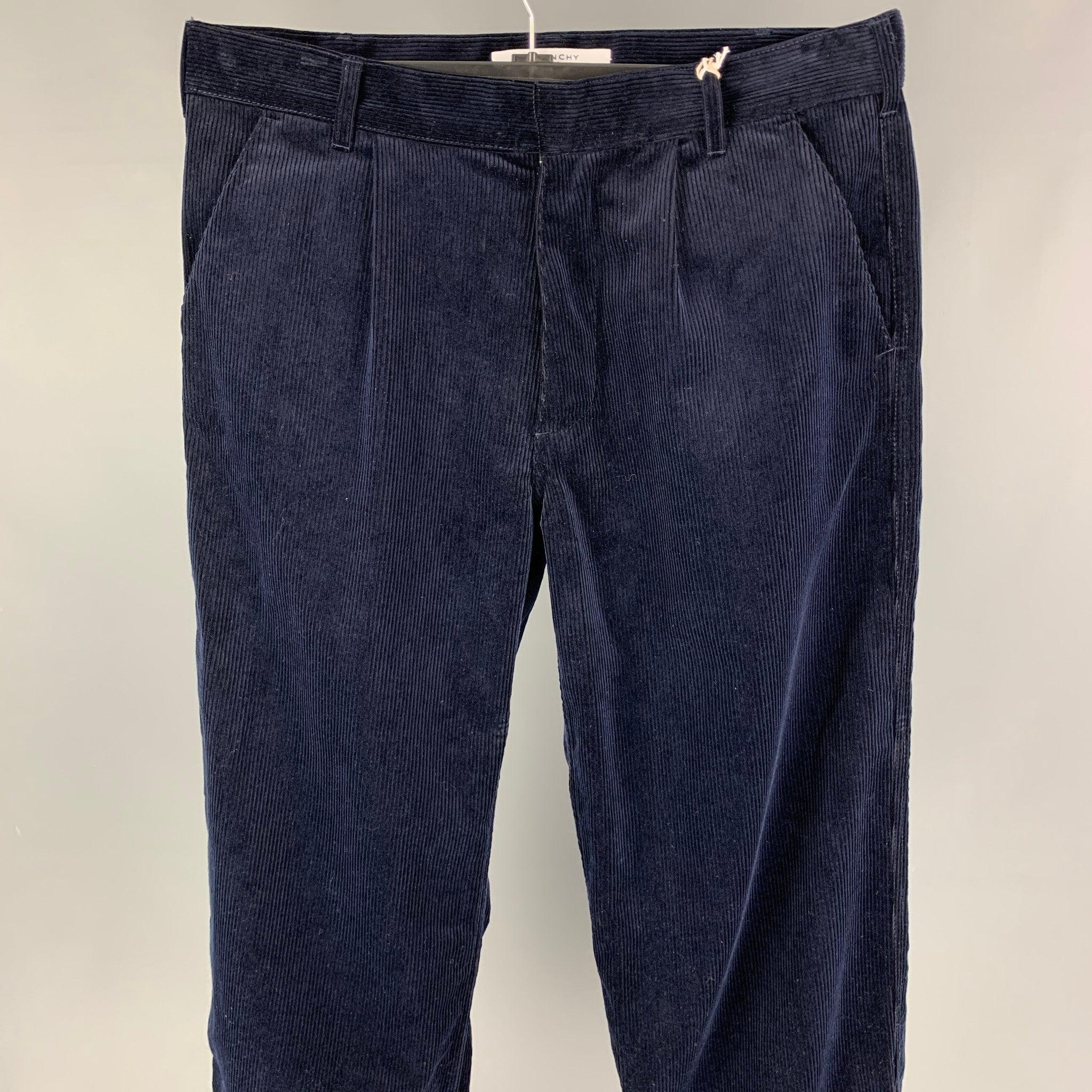 GIVENCHY casual pants comes in a midnight blue cotton corduroy featuring a tapered leg, zipped cuffs, 3GV rubber tag, front tab, and a zip fly closure.
New with Tags.
 

Marked:   48 

Measurements: 
  Waist: 32 inches  Rise: 12 inches  Inseam: 30