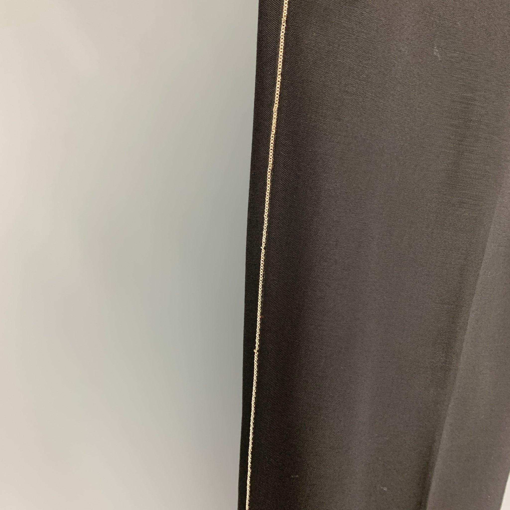GIVENCHY dress pants comes in a black wool featuring a flat front, chain link trim, front tab, and a zip fly closure. Made in Italy.
Very Good
Pre-Owned Condition. 

Marked:   52 

Measurements: 
  Waist: 36 inches  Rise: 10 inches  Inseam: 30