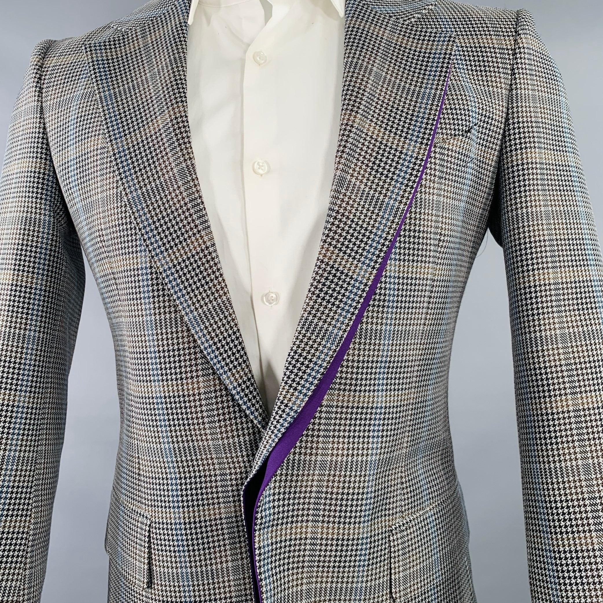 GIVENCHY sport coat
in a grey and black wool blend fabric featuring a subtle contrasting purple twill trim, plaid pattern, notch lapel, single vented back, and hidden single button closure. Made in Italy.Excellent Pre-Owned Condition. 

Marked:   IT