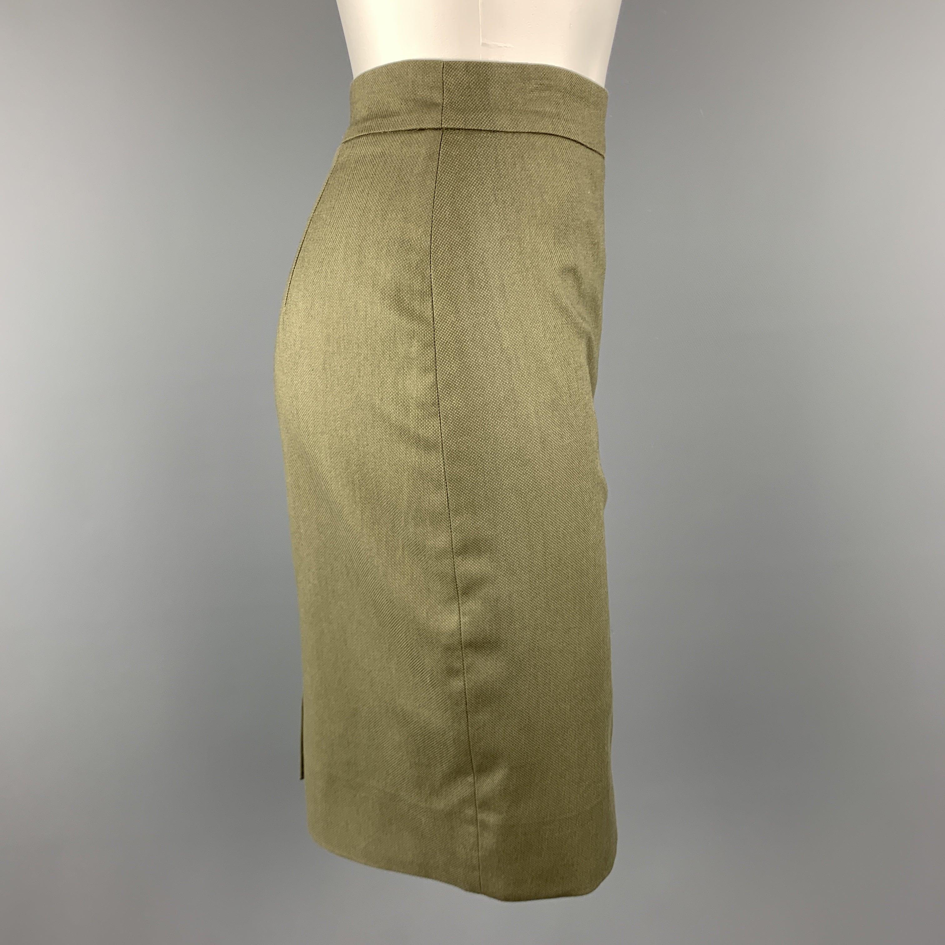 GIVENCHY pencil skirt comes in olive green cotton stretch woven canvas with back slit. Made in Italy.Excellent
Pre-Owned Condition. 

Marked:   IT 36 

Measurements: 
  Waist: 26 inches Hip:
34 inches Length: 20 inches 
  
  
 
Reference: