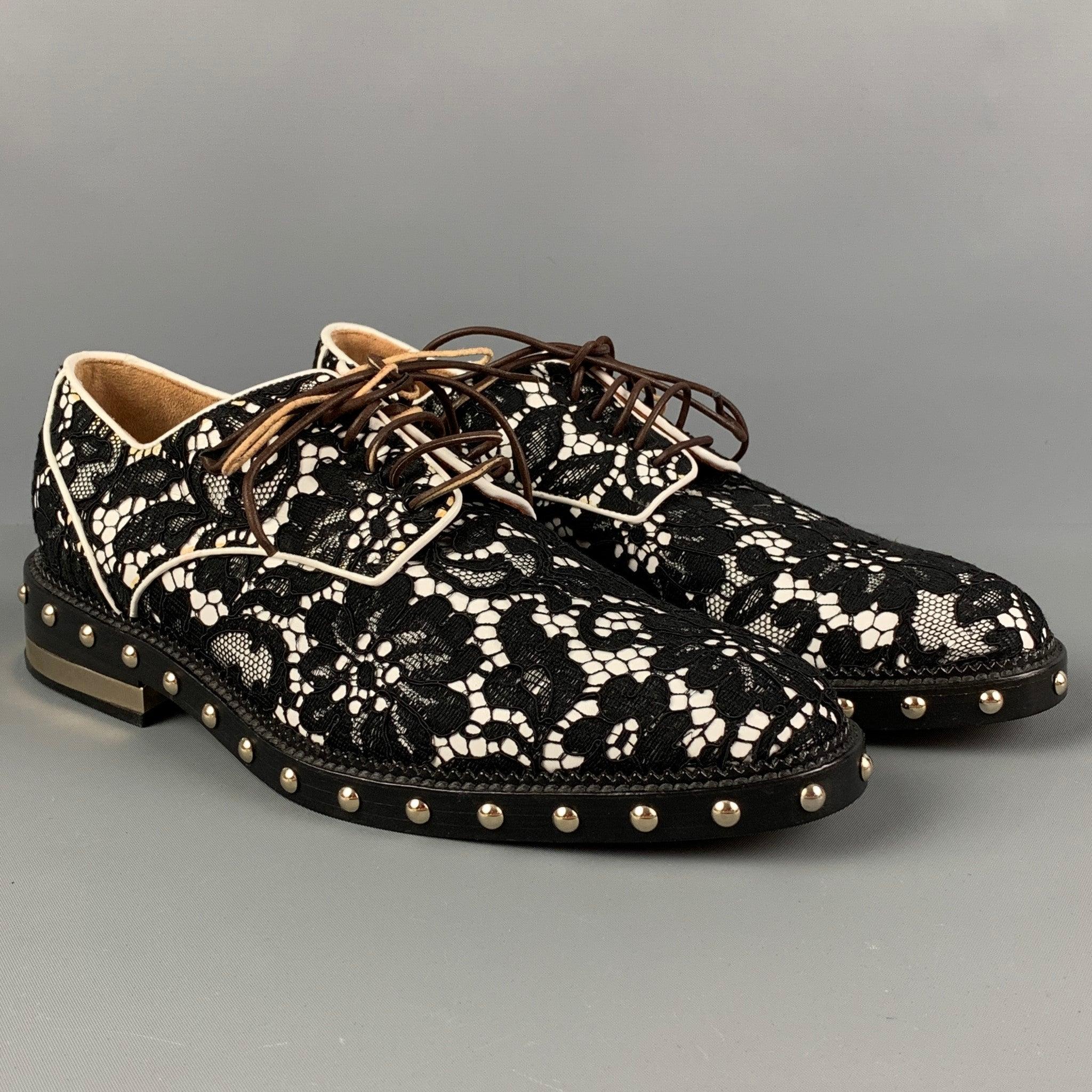 GIVENCHY shoes comes in a black & white lace material featuring studded details, gold tone hardware, round toe, and a leather lace up closure. Made in Italy.
Good Pre-Owned Condition. Moderate wear at laces. As-Is.  

Marked:   36.5Outsole: 10.75