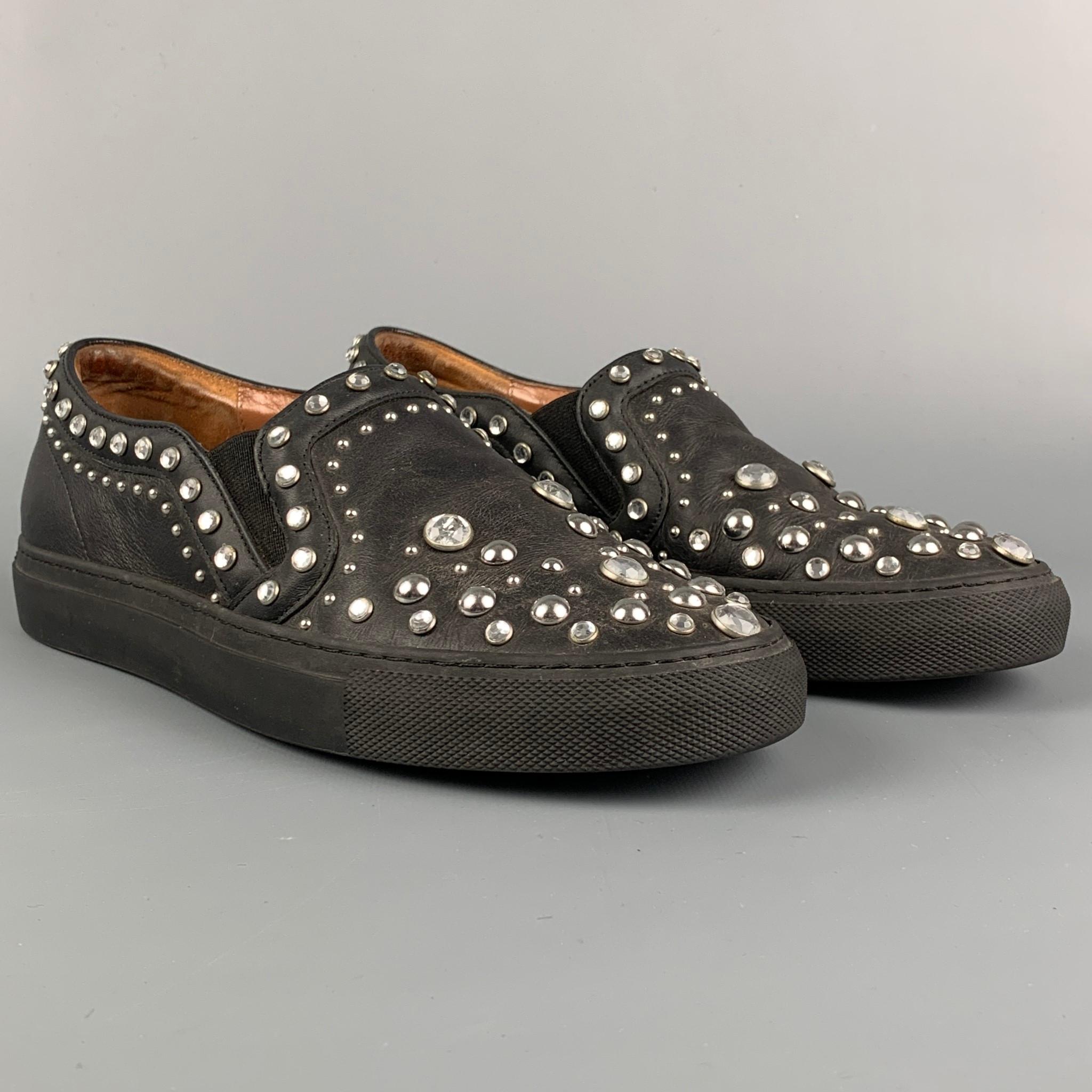 GIVENCHY sneakers comes in a black leather featuring studded details, rhinestones, slip on, and a rubber sole. Includes box. Made in Italy.

Good Pre-Owned Condition.
Marked: 37
Original Retail Price: $650.00

Outsole: 10.25 in. x 3.75 in. 