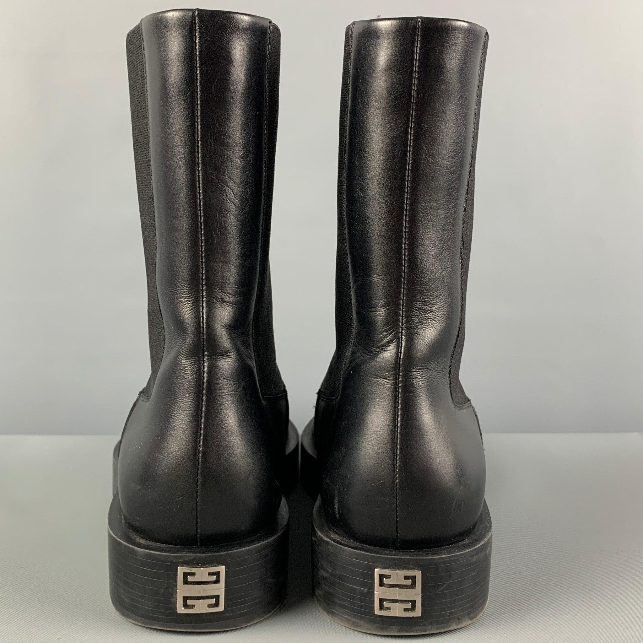 GIVENCHY boots comes in a black leather featuring a square toe, bacl metal plaque, and a chelsea style. Made in Italy.
Very Good
Pre-Owned Condition. Light wear. As-is.  

Marked:   SA 0231 41 

Measurements: 
  Length: 11.75 inches Width: 4.5