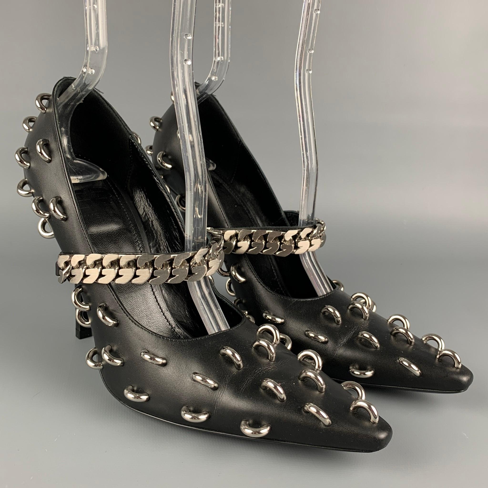 GIVENCHY pumps comes in a black leather with silver tone hardware featuring a mary jane style, front chain link design, and a stiletto heel. Made in Italy. 

Excellent Pre-Owned Condition.
Marked:  38
Original Retail Price:
