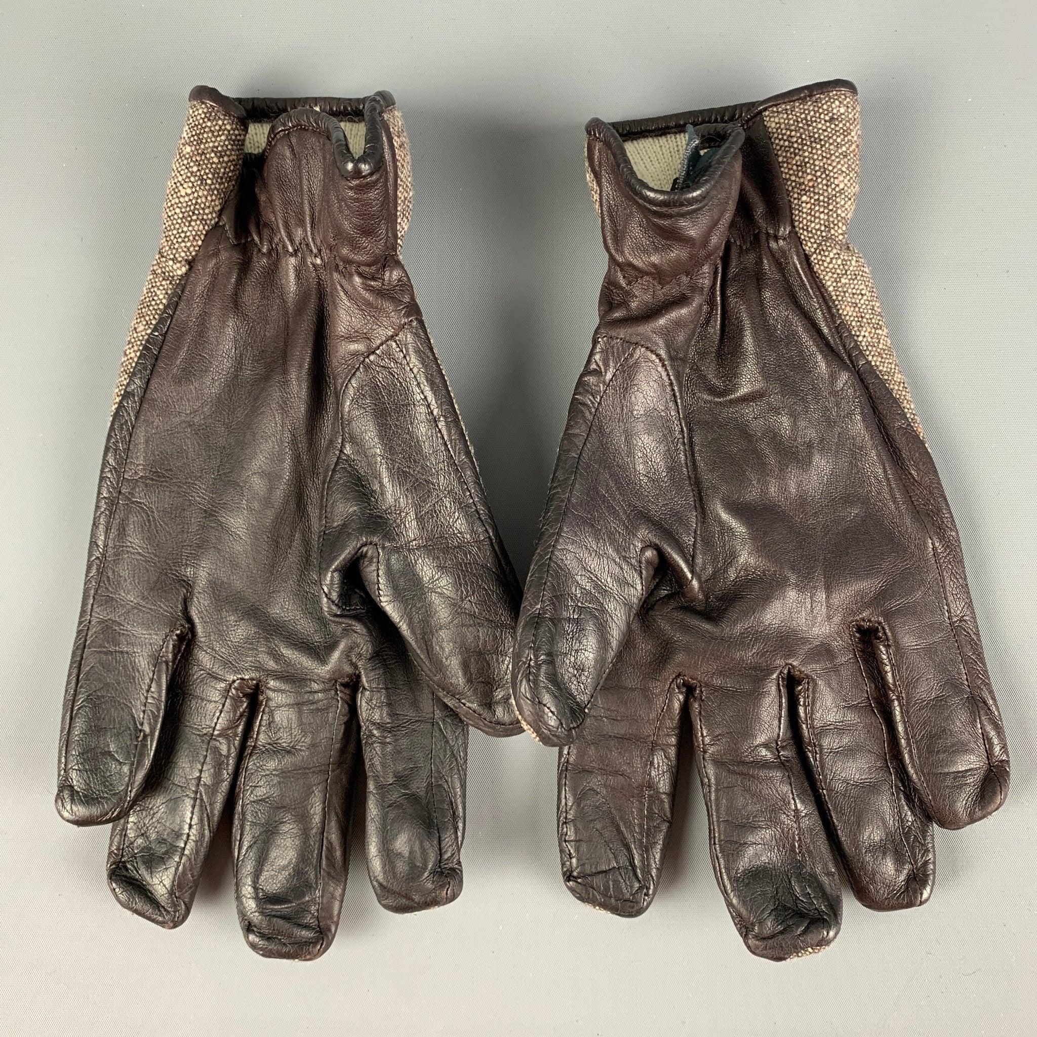 GIVENCHY gloves comes in a brown & cream mixed materials. Hand finished in Italy.
Very Good
Pre-Owned Condition. 

Marked:   9 

Measurements: 
  Height: 9.5 inches Length: 4.25 inches 
  
  
 
Reference: 122560
Category: Gloves
More Details
   