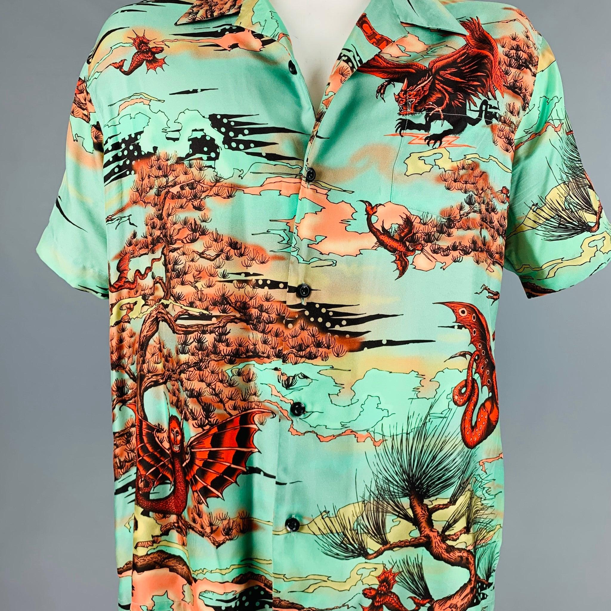 GIVENCHY short sleeve shirt
in a green silk fabric featuring red and orange fantasy print, camp style, and button closure.Very Good Pre-Owned Condition. Minor signs of wear, minor mark. Care tags removed. 

Marked:   42 

Measurements: 
 
Shoulder: