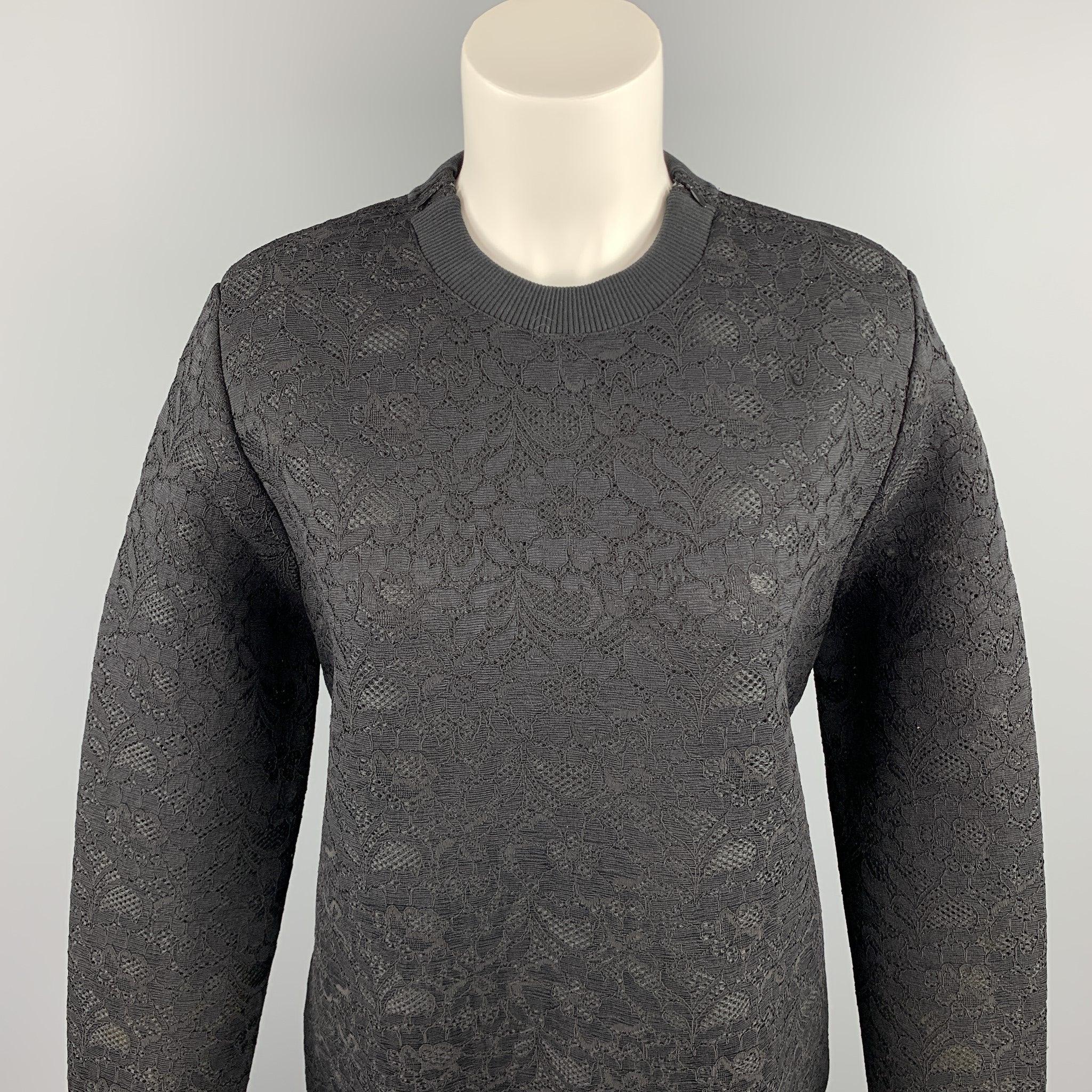 GIVENCHY pullover comes in a black lace polyester blend featuring shoulder zipper details and a crew-neck. Made in Italy.New With Tags. 

Marked:   IT 36 

Measurements: 
 
Shoulder: 16 inches 
Bust: 40 inches 
Sleeve: 27.5 inches 
Length: 26 inches