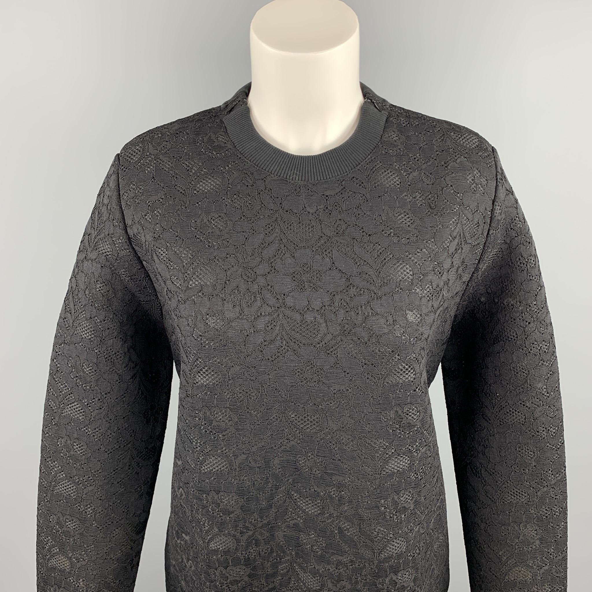 GIVENCHY pullover comes in a black lace polyester blend featuring shoulder zipper details and a crew-neck. Made in Italy.

New With Tags.
Marked: IT 36

Measurements:

Shoulder: 16 in. 
Bust: 40 in. 
Sleeve: 27.5 in. 
Length: 26 in. 