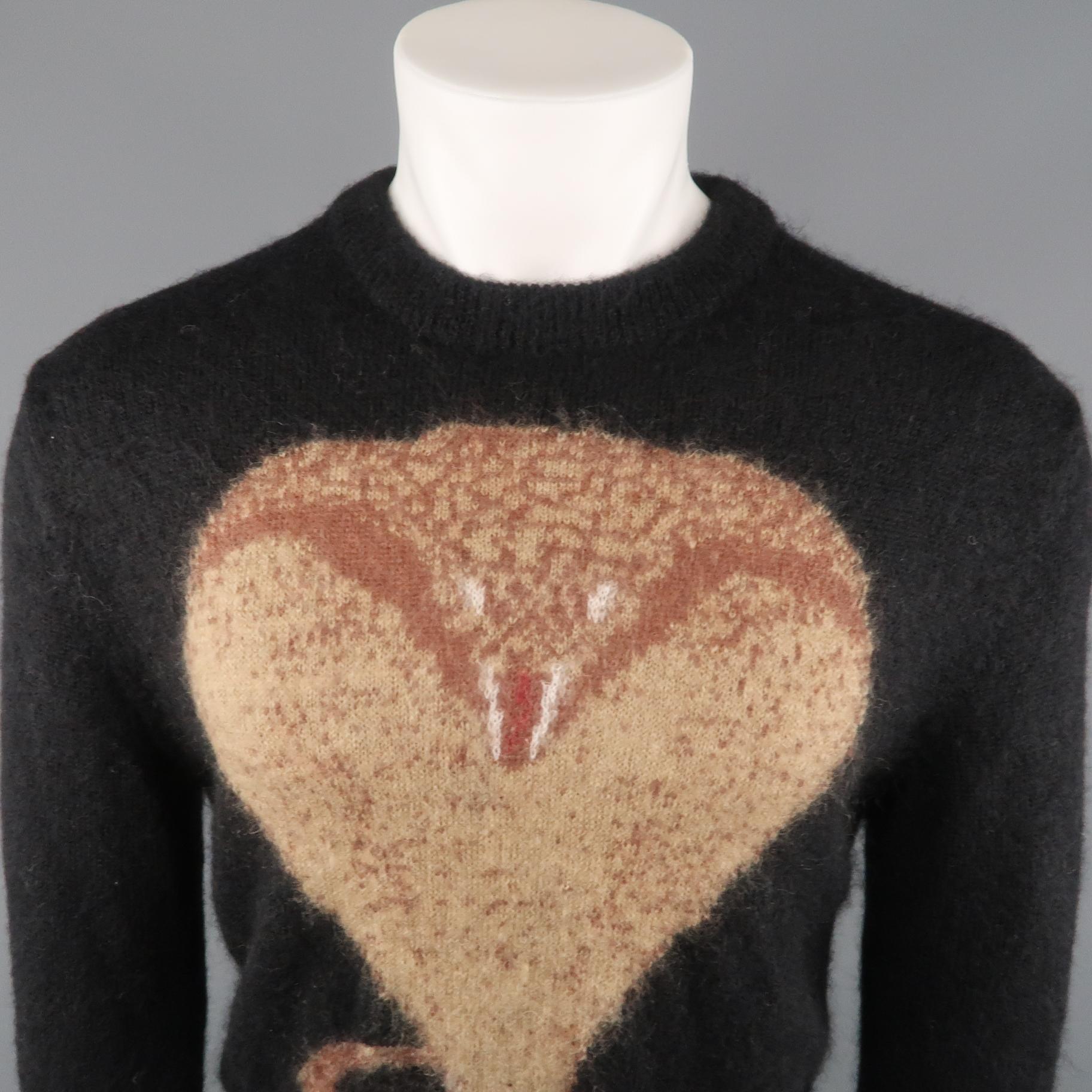 GIVENCHY sweater comes in a black mohair blend featuring a front oversized cobra print and a ribbed collar. Fall 2016. Made in Italy.
 
Excellent Pre-Owned Condition.
Marked: S
 
Measurements:
 
Shoulder: 20 in.
Chest: 44 in.
Sleeve: 29 in.
Length: