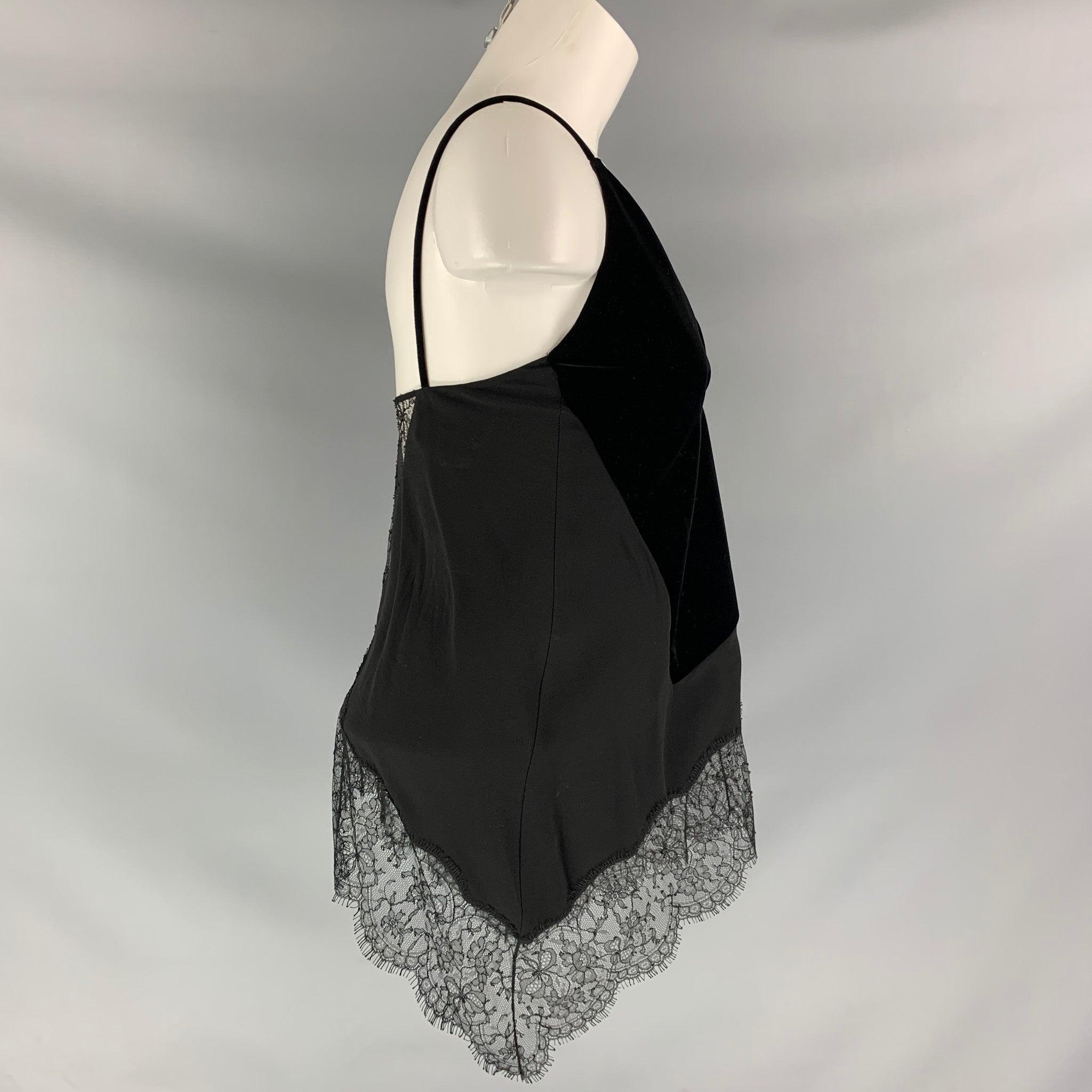 GIVENCHY V- neck dress top comes in black viscose and velvet fabrics, silk lined features lace details.Excellent Pre-Owned Condition. 

Marked:   34 

Measurements: 
  Bust: 32 inFront Length: 14 inBack Length: 13 in
  
  
 
Reference: