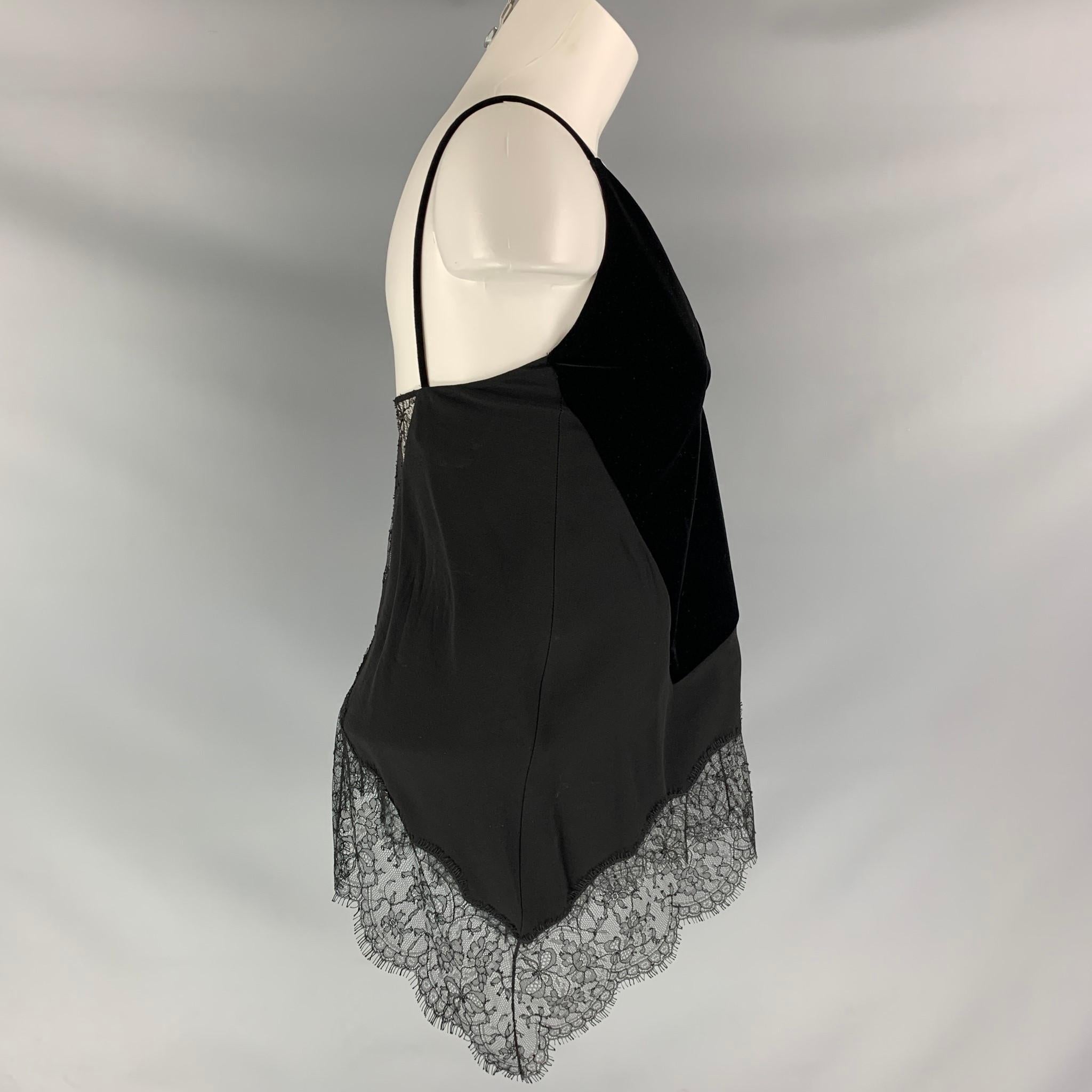 GIVENCHY V- neck dress top comes in black viscose and velvet fabrics, silk lined features lace details.

Excellent Pre-Owned Condition.
Marked: 34

Measurements:

Bust: 32 in
Front Length: 14 in
Back Length: 13 in
SKU: 111314
Category: Dress