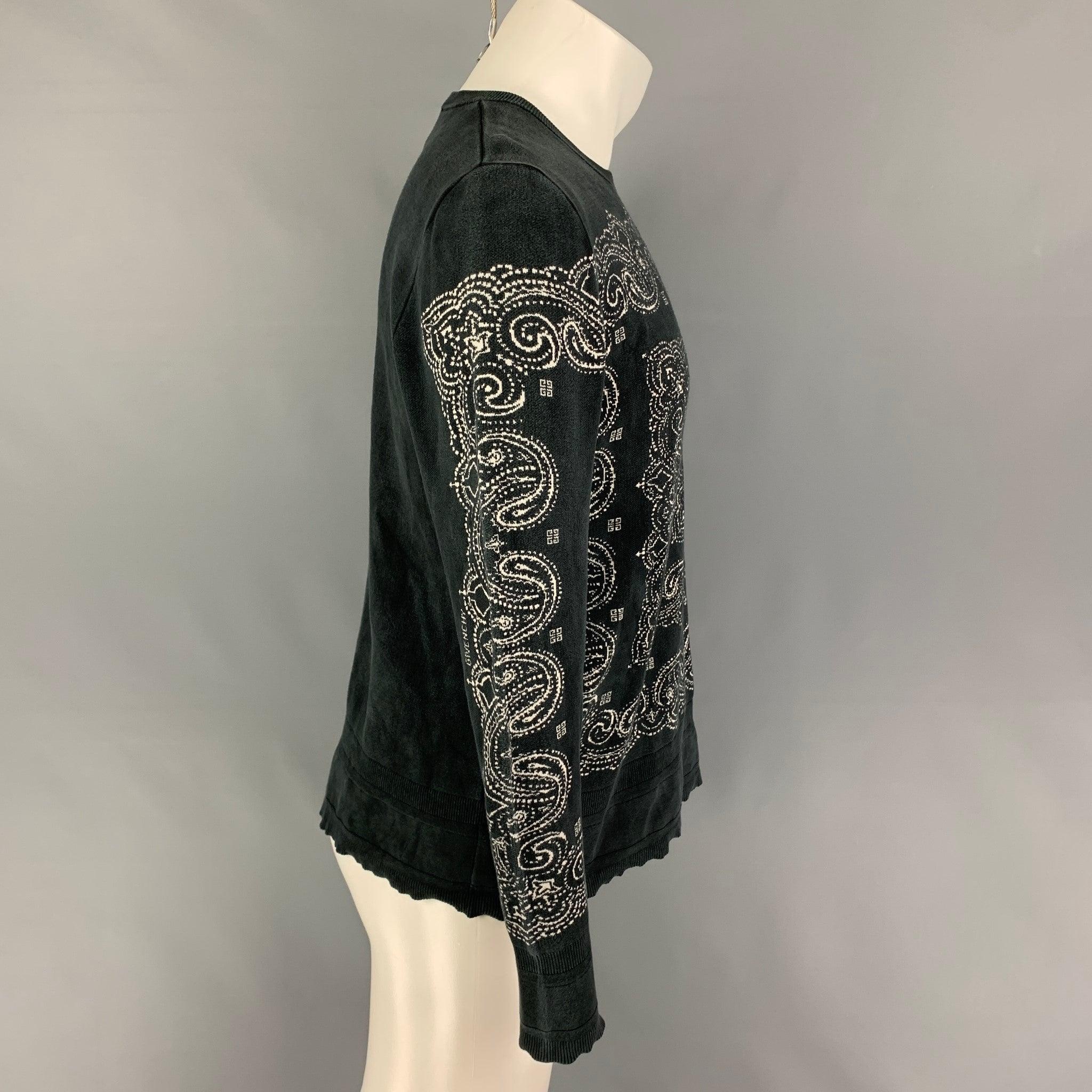 GIVENCHY pullover comes in a black & white silk featuring a paisley print throughout, distressed, and a crew-neck. Made in England.
Good
Pre-Owned Condition. 

Marked:   S 

Measurements: 
 
Shoulder: 17 inches  Chest: 40 inches  Sleeve: 27 inches 