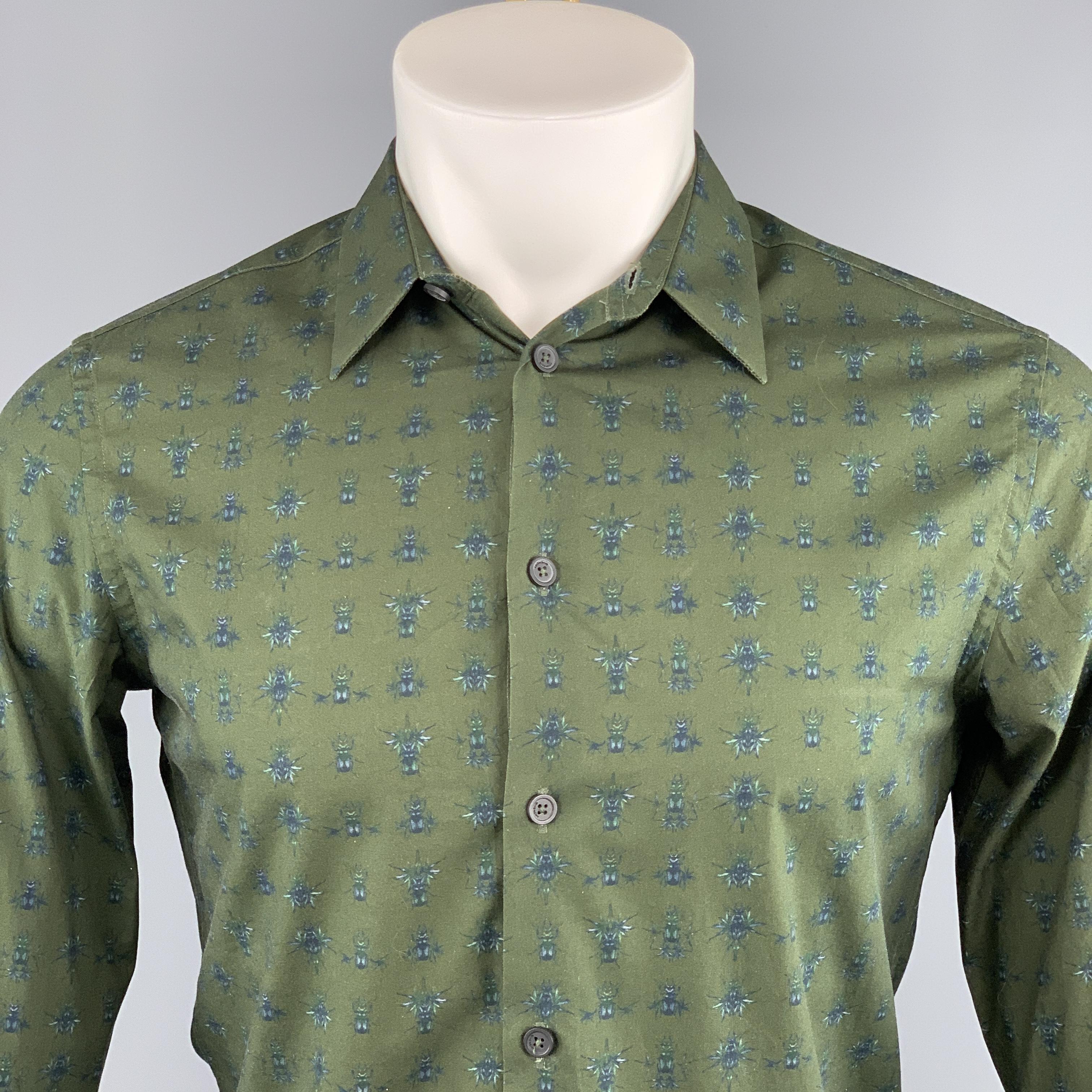 GIVENCHY Long Sleeve Shirt comes in a olive scarab print cotton featuring a button up style and a spread collar. Made in Portugal.
 

Excellent Pre-Owned Condition.
Marked: 38

Measurements:

Shoulder: 15.5 in. 
Chest: 38 in. 
Sleeve: 26 in.