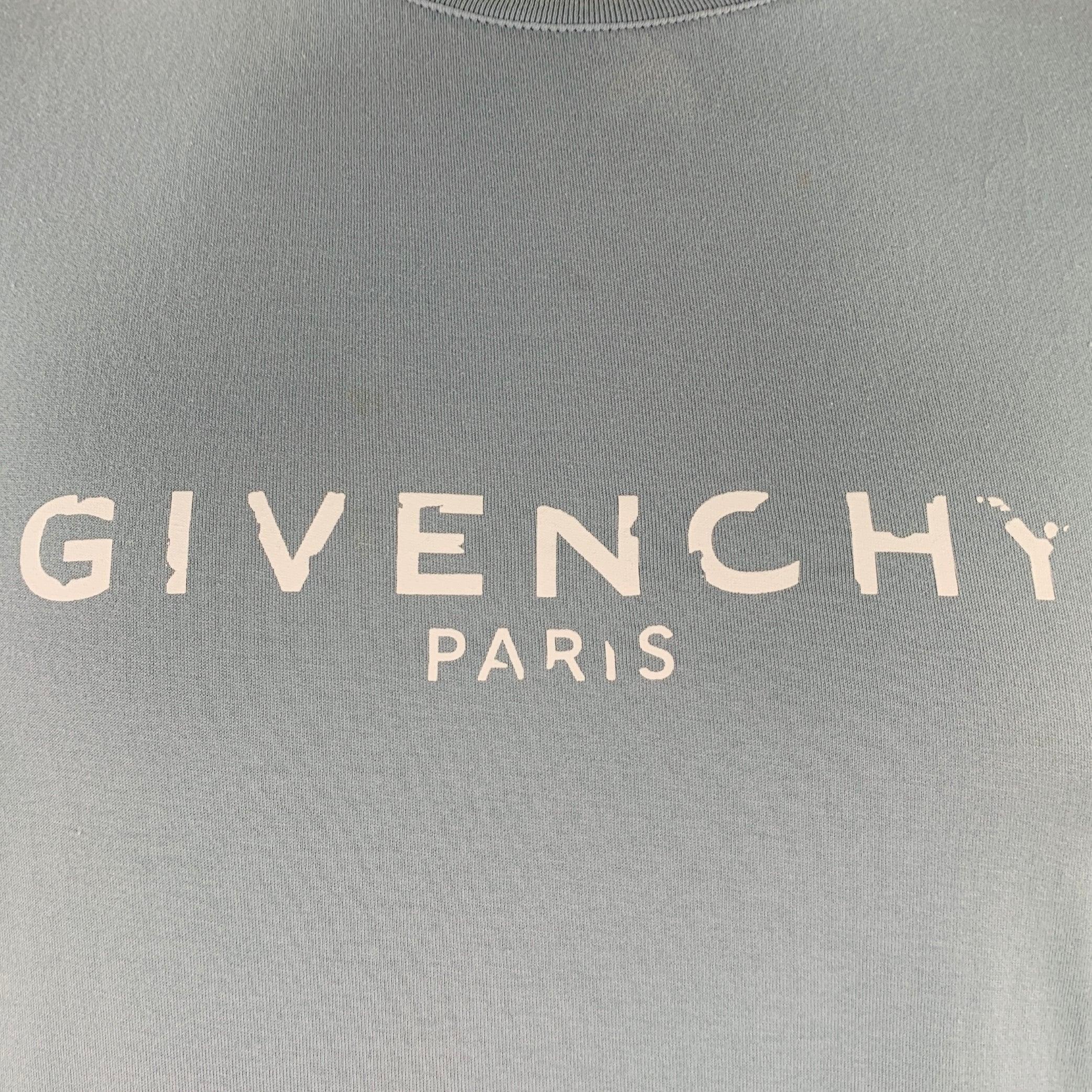 GIVENCHY t-shirt
in a blue cotton jersey featuring distressed logo, short sleeves, and crew neck. Made in Portugal.Very Good Pre-Owned Condition. Very minor mark above logo. 

Marked:   XL 

Measurements: 
 
Shoulder: 18.5 inches Chest: 48 inches