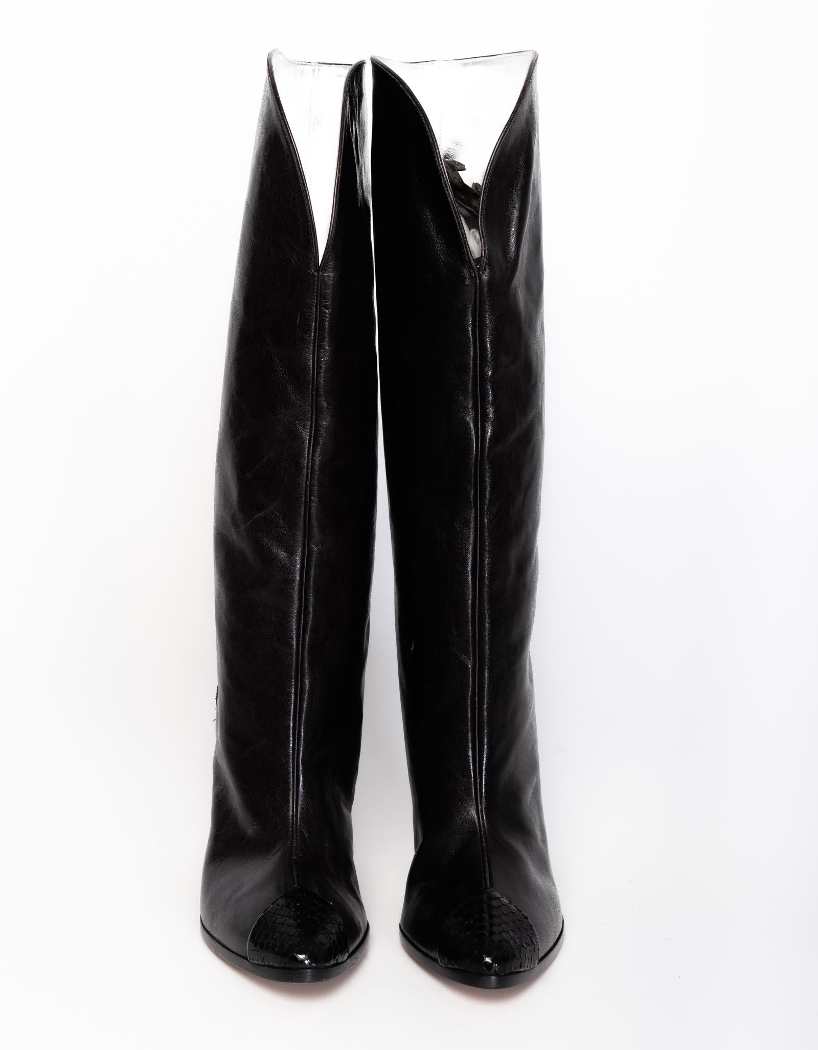 Givenchy western style boots in black made with leather and snake skin on the back of the heel. 

COLOR: Black
MATERIAL: Leather with snake skin on heel
ITEM CODE: ES0128
SIZE: 36 EU / 5 US
HEEL HEIGHT: 75 mm (3 inches)
HEIGHT OF BOOT LEG: 300 mm