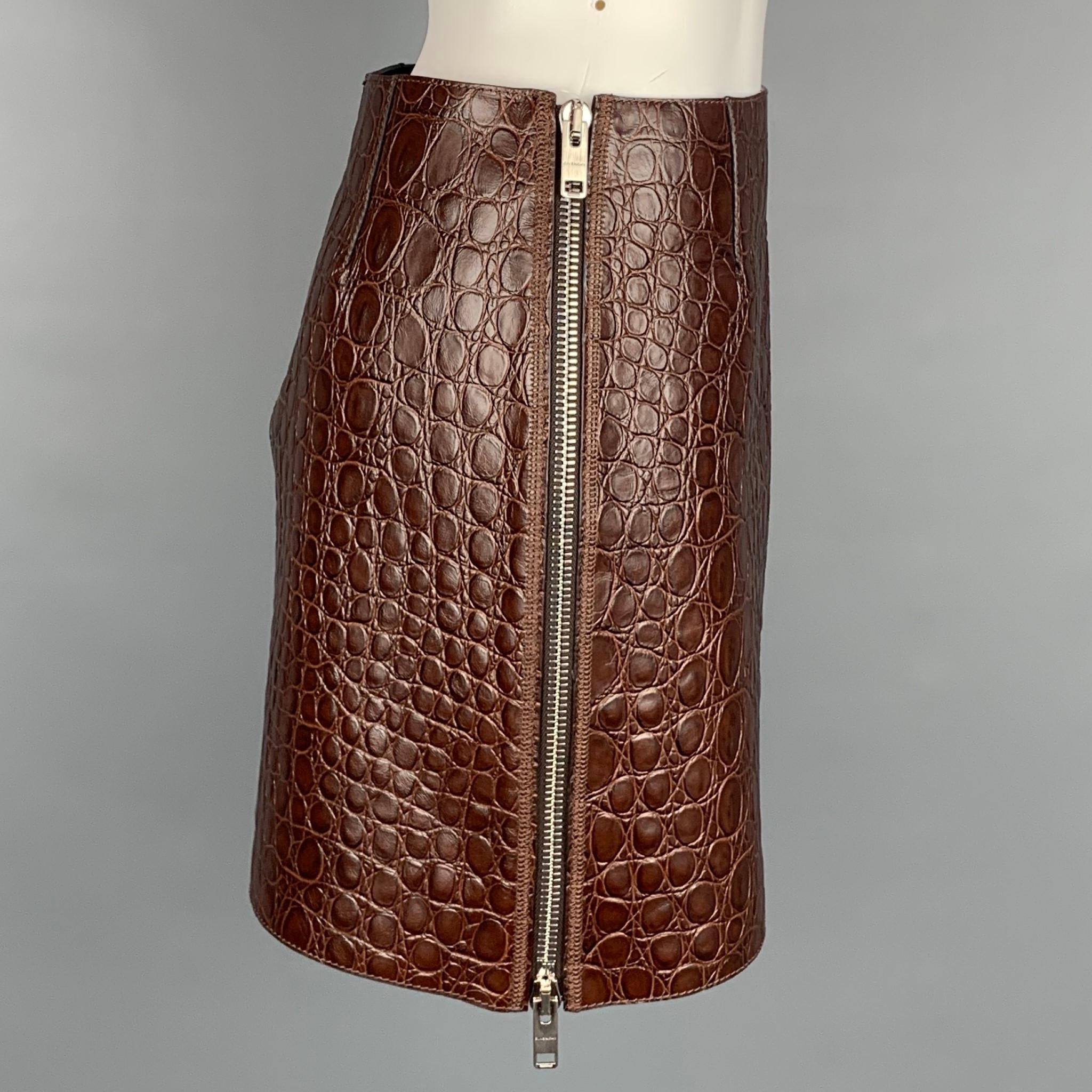 GIVENCHY Spring Summer 2021 mini skirt comes in a brown crocodile effect vintage leather featuring double side zipper closures. Made in Italy. 

Excellent Pre-Owned Condition.
Marked:  36
Original Retail Price: $2,230.00

Measurements:

Waist: 28