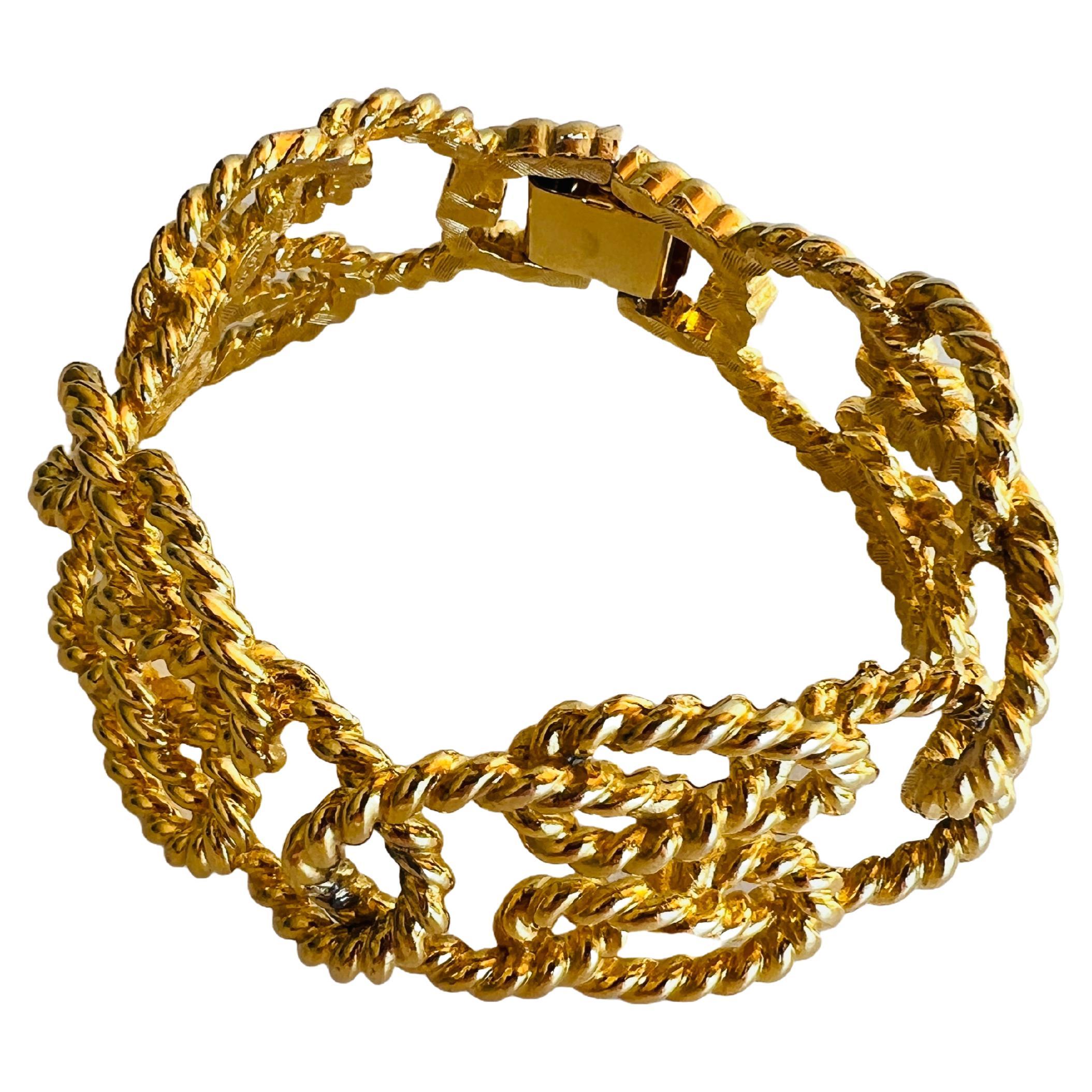 Step into the world of timeless elegance with this stunning vintage Givenchy bracelet. Crafted in the late 20th century, this piece showcases the iconic luxury and sophistication that the House of Givenchy is renowned for. The bracelet features an