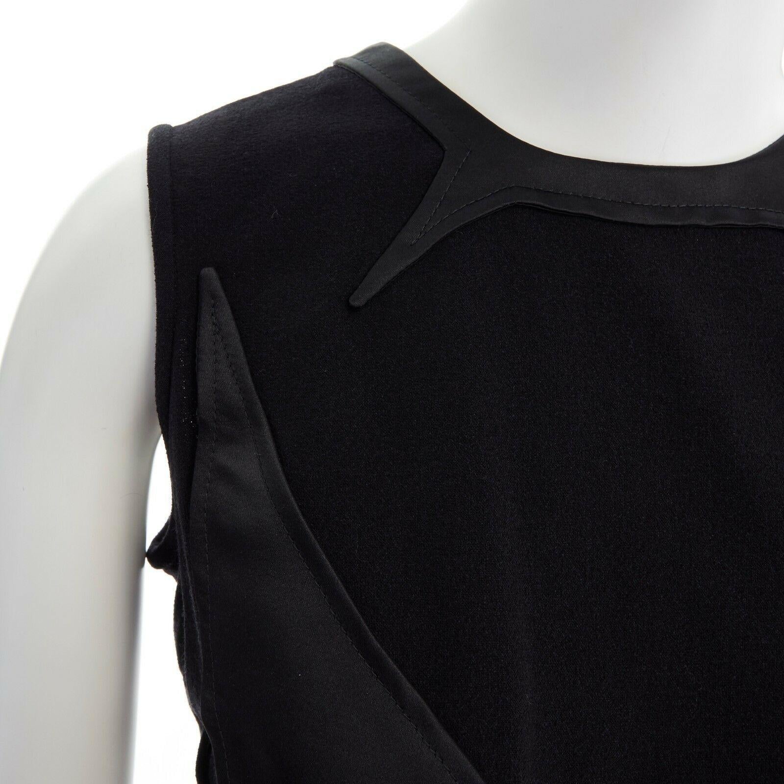 GIVENCHY TISCI 2011 black angular patched sheer skirt layer dress FR38 M
GIVENCHY BY RICCARDO TISCI
FROM THE 2012 COLLECTION
Wool, polyamide, elastane. 
Black. 
Round neckline. 
Sleeveless. 
Angular pattern patch at front. 
Dropped waist. 
Flared